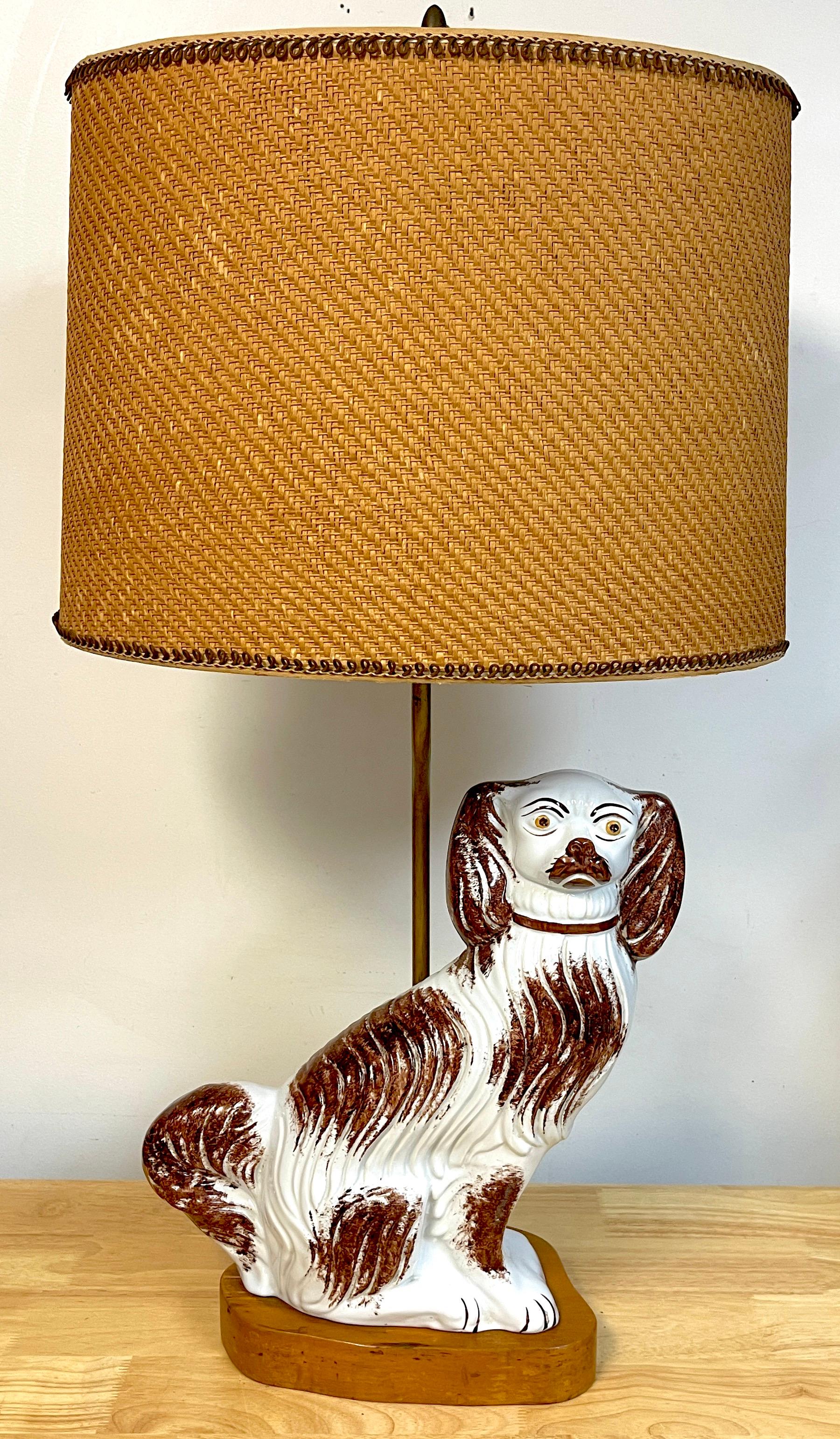 Staffordshire brown sponge decorated seated spaniel, now as a lamp 
Complete with vintage woven natural shade, The good size 14.5