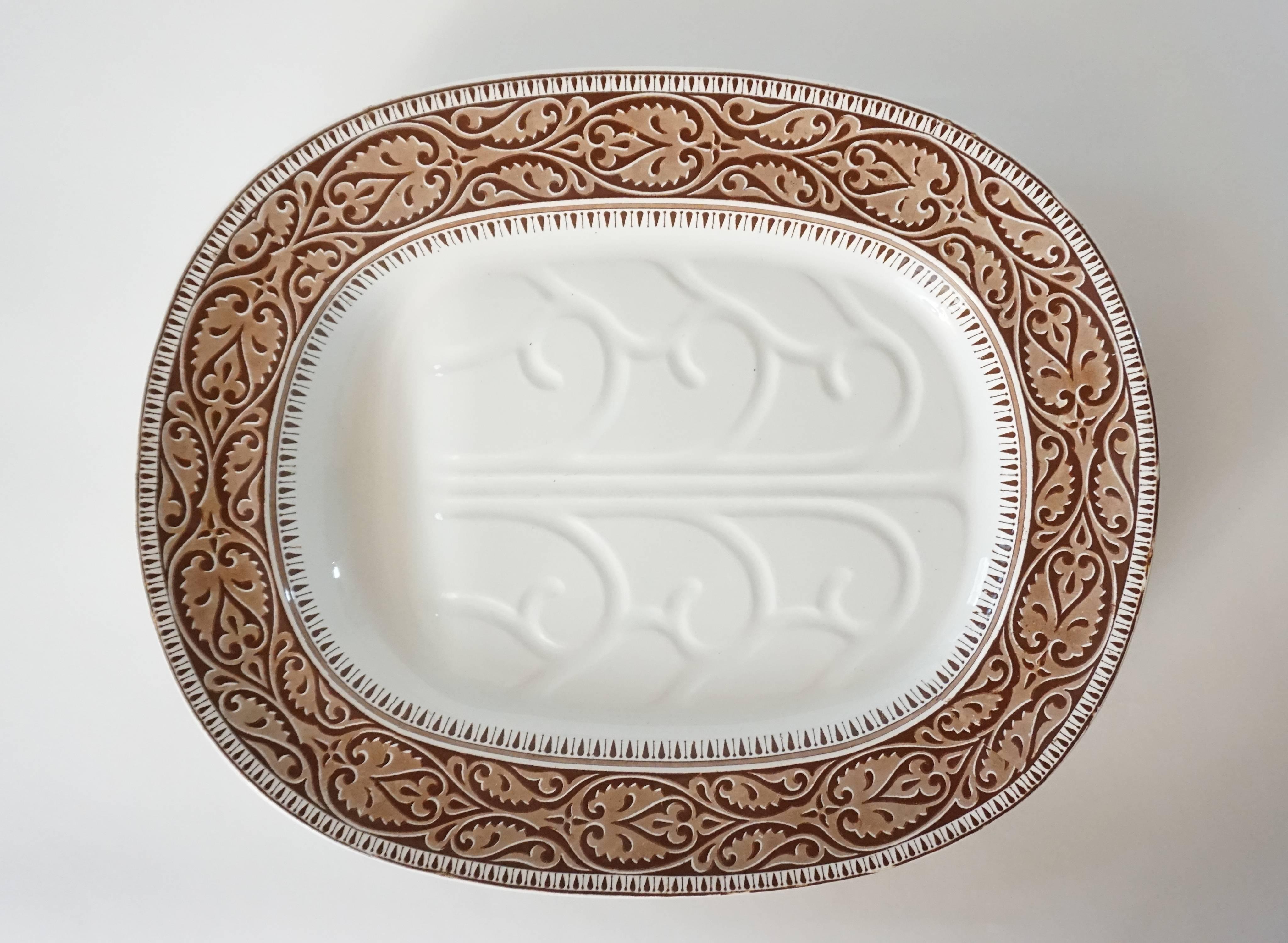 Large English Staffordshire 'well-and-tree' serving platter having brown transfer 'tracery' band border. Reverse marked with 'Copeland Late Spode', British registry marks translating to production on October 14th, 1859, and impressed crown and