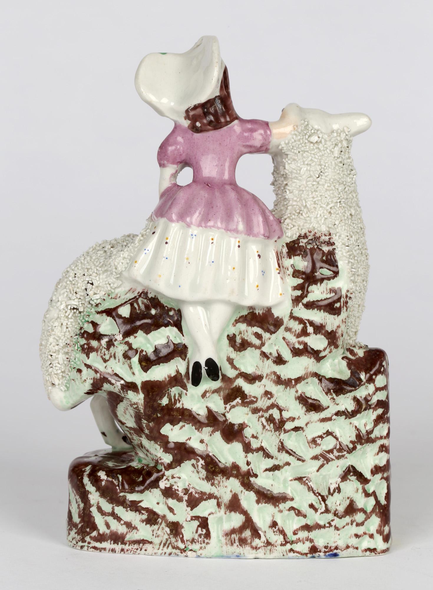 Early Victorian Staffordshire English Pottery Figure of a Girl with a Large Sheep For Sale