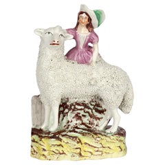 Staffordshire English Pottery Figure of a Girl with a Large Sheep