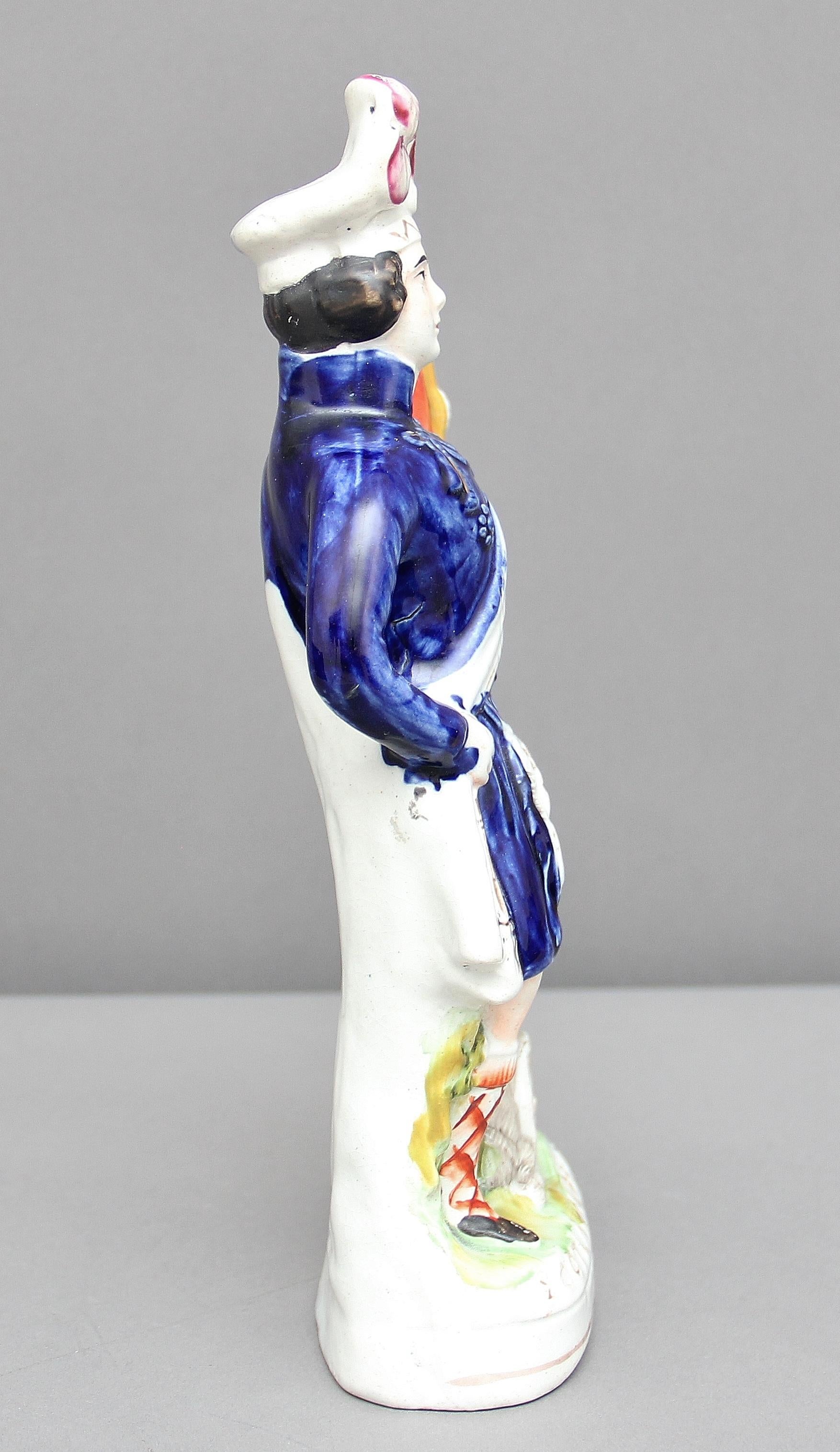 19th century Staffordshire figure titled “Scotland’s Pride” showing a Scotsman holding a flag with a canon at his feet. Good color and in great condition, circa 1854.
 