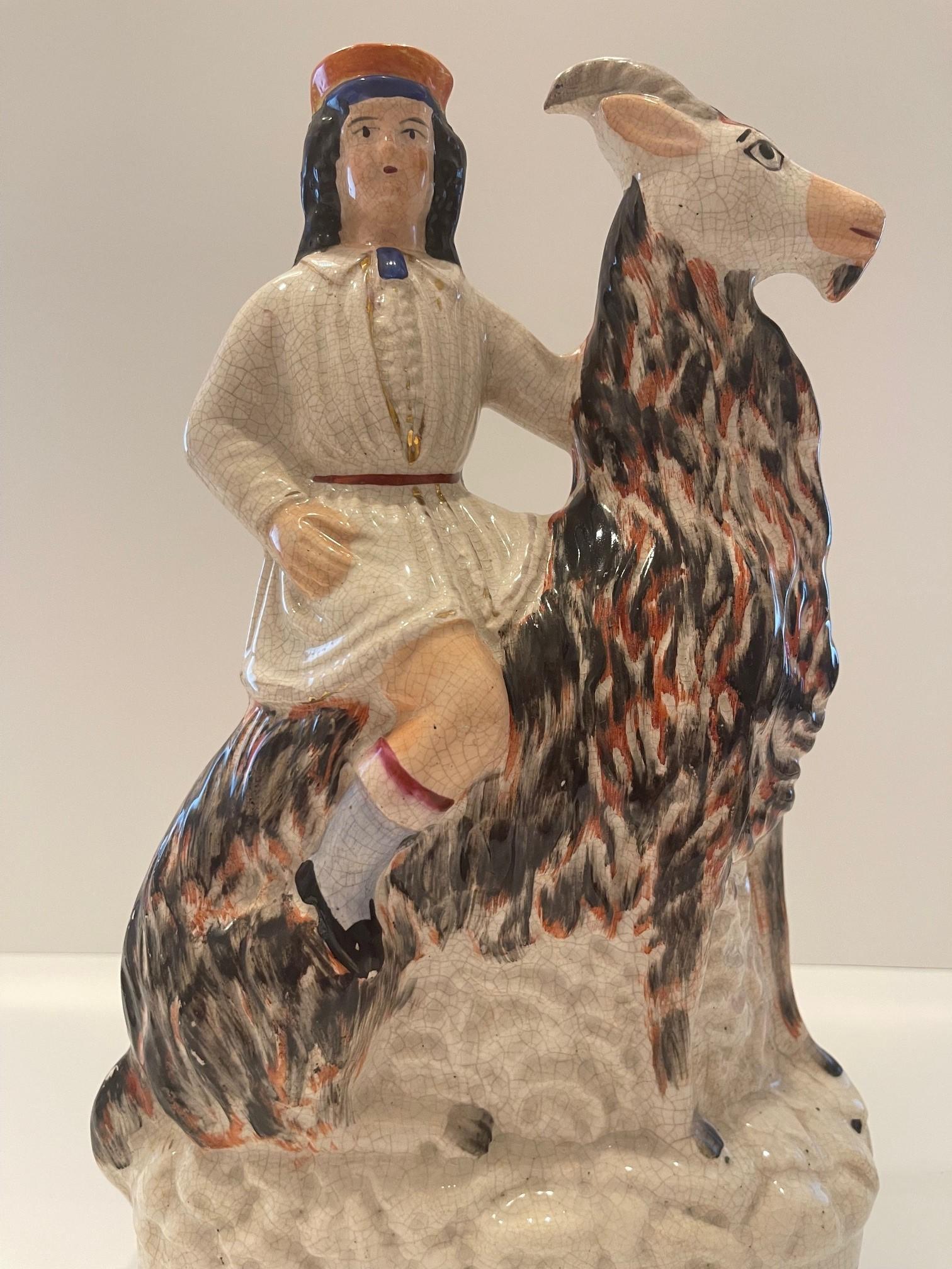 English Staffordshire figure of boy on a goat Circa 1865 For Sale