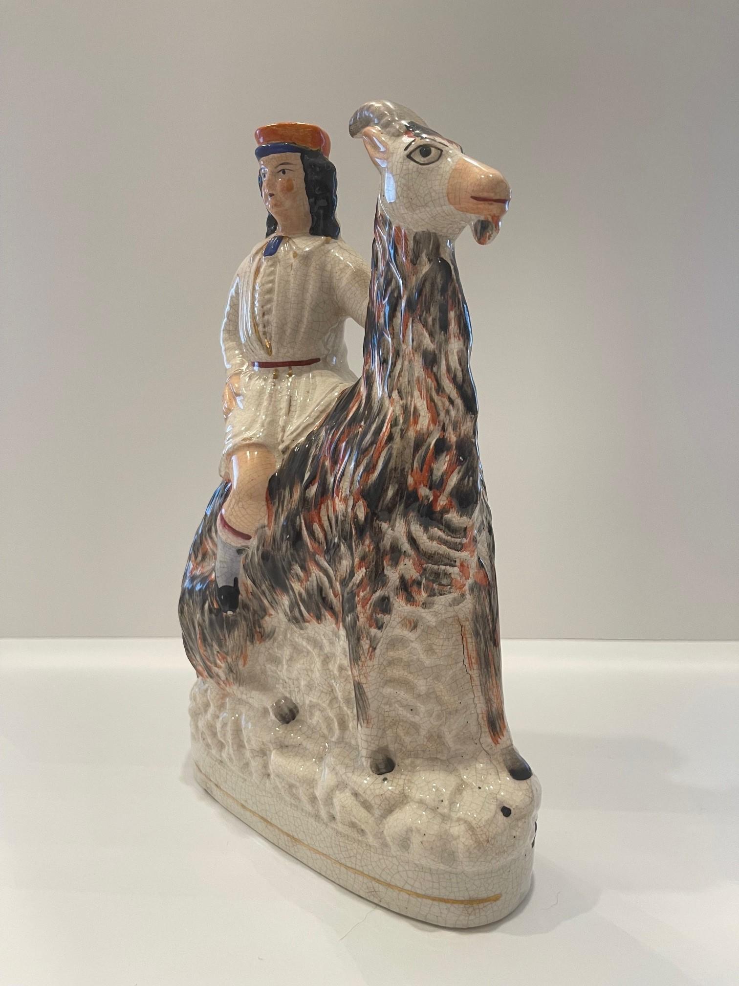 Mid-19th Century Staffordshire figure of boy on a goat Circa 1865 For Sale