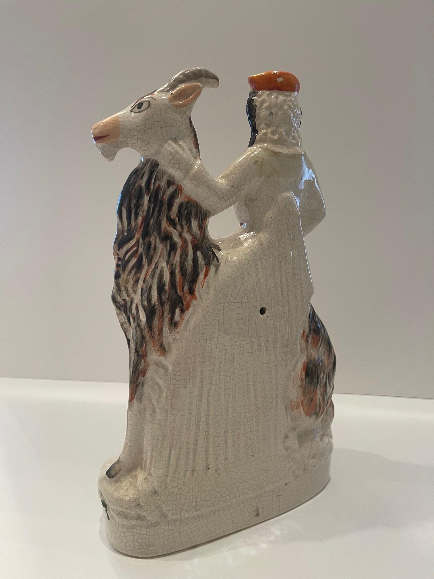 Porcelain Staffordshire figure of boy on a goat Circa 1865 For Sale