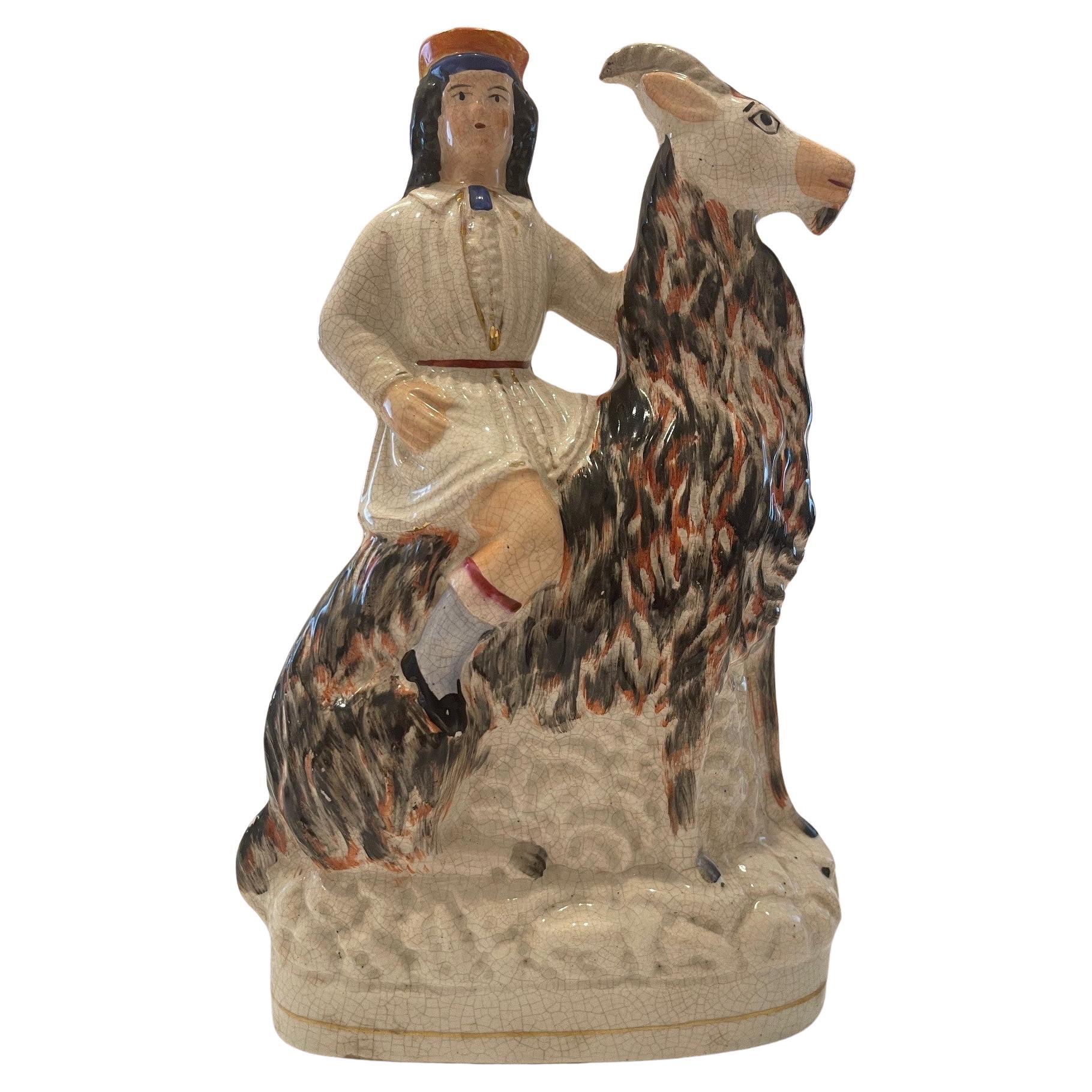 Staffordshire figure of boy on a goat Circa 1865 For Sale