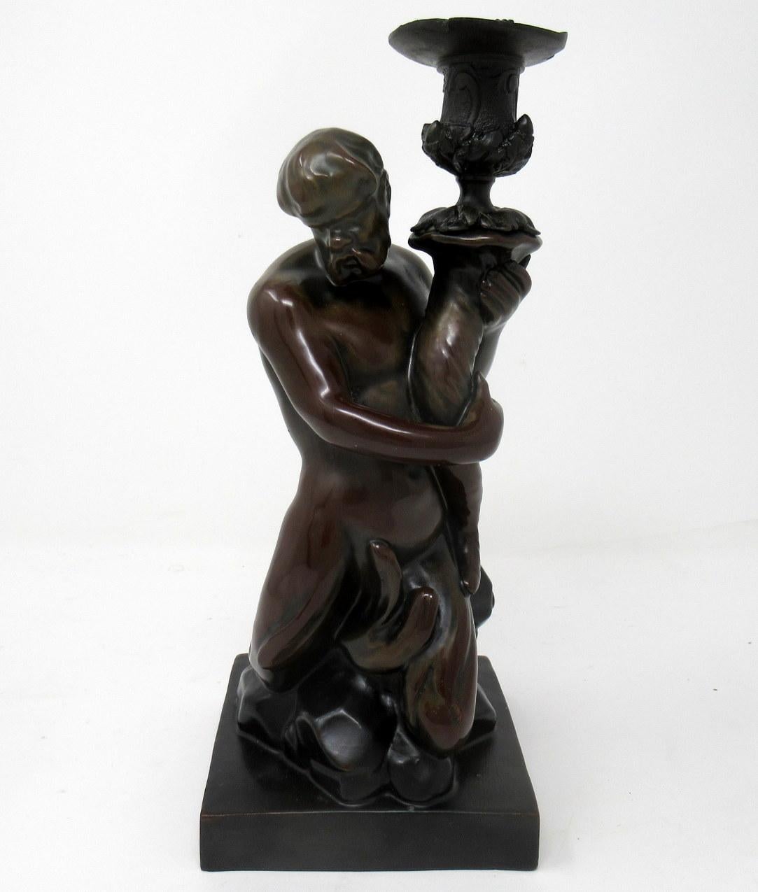 

Rare Bronze Glazed Staffordshire Pottery Male Nude Figure of a Triton made by Wood and Caldwell after a bronze by John Flaxman 1755-1826, first quarter of the Nineteenth Century. 

Le personnage est assis sur un rocher et tient une corne