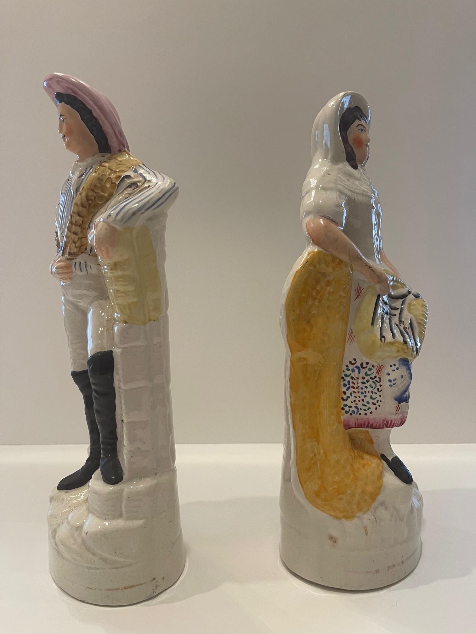 Staffordshire Figures of a women and man holding fish Circa 1880 In Good Condition For Sale In Flower Mound, TX