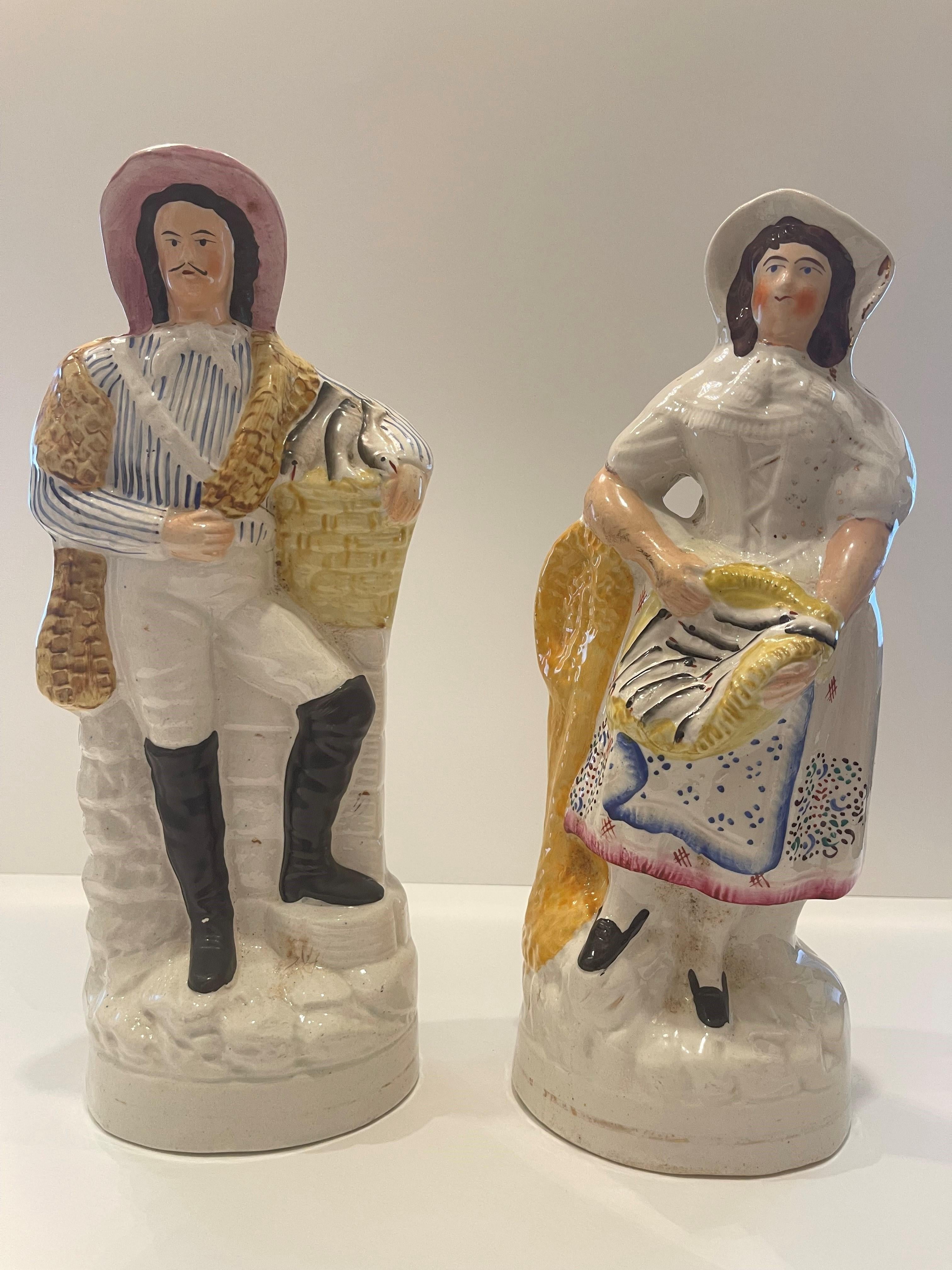 Staffordshire Figures of a women and man holding fish Circa 1880 For Sale 1