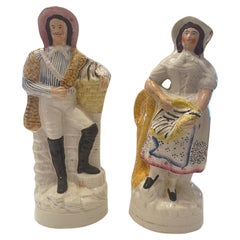 Antique Staffordshire Figures of a women and man holding fish Circa 1880