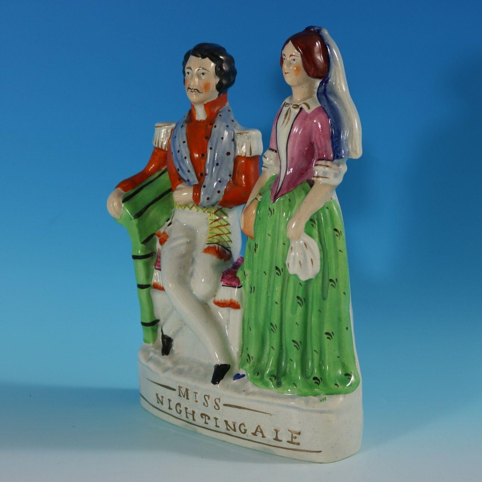Staffordshire pottery figure with which features Florence Nightingale tending to a wounded soldier, stood on an oval base. The piece is titled, 'MISS NIGHTINGALE'. Multi-coloured version. Dull gilt embellishment. Book reference,'Victorian