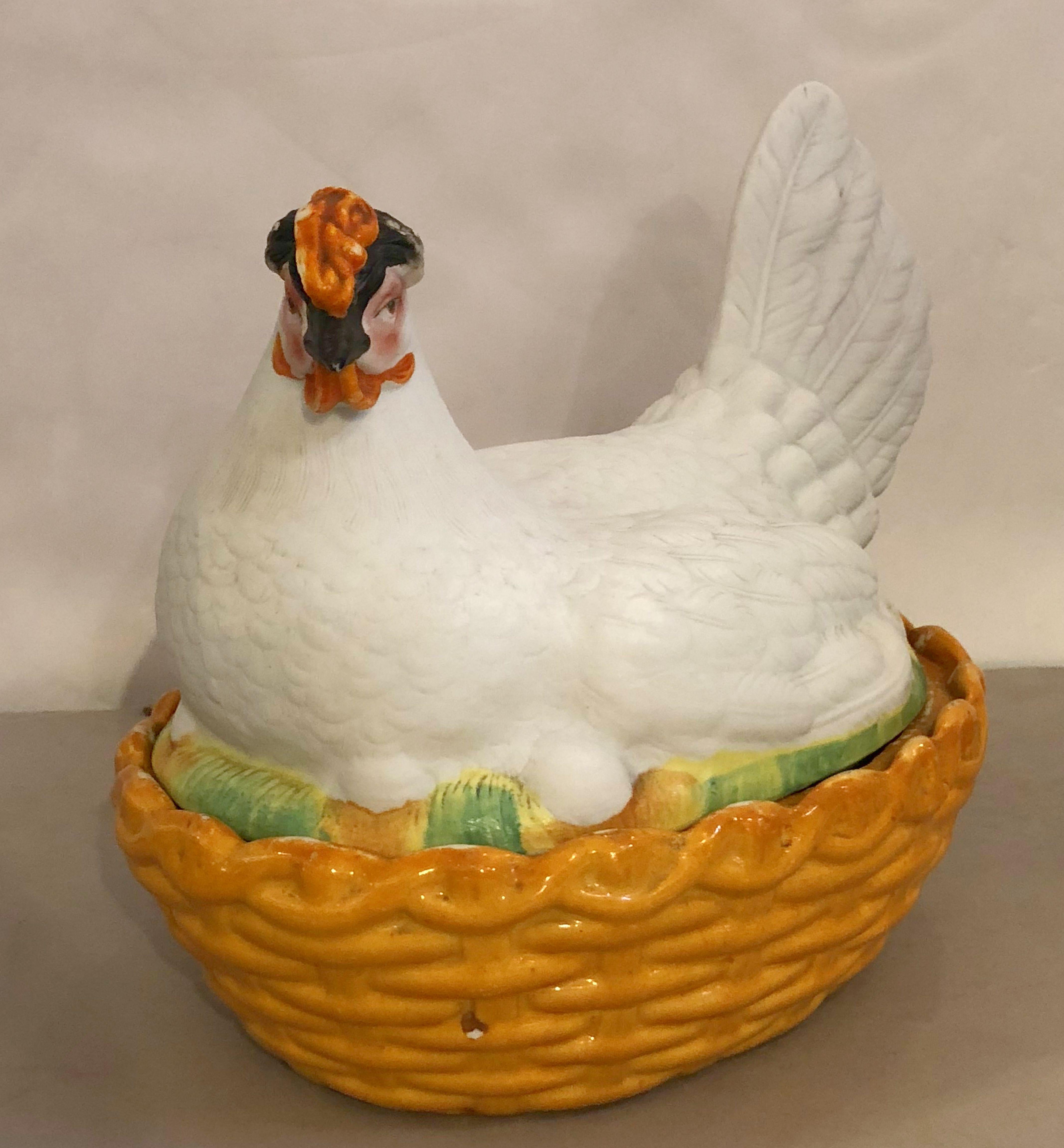 A fine 19th century English hen on nest tureen from the Staffordshire Potteries, featuring a lid in the form of a chicken hen with eggs with a fitted base stylized as a woven basket.