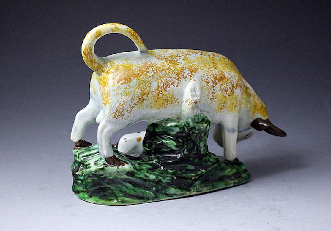 Staffordshire Pearlware Figure of a Bull and Bull Terrier on Green Base In Good Condition For Sale In Woodstock, OXFORDSHIRE