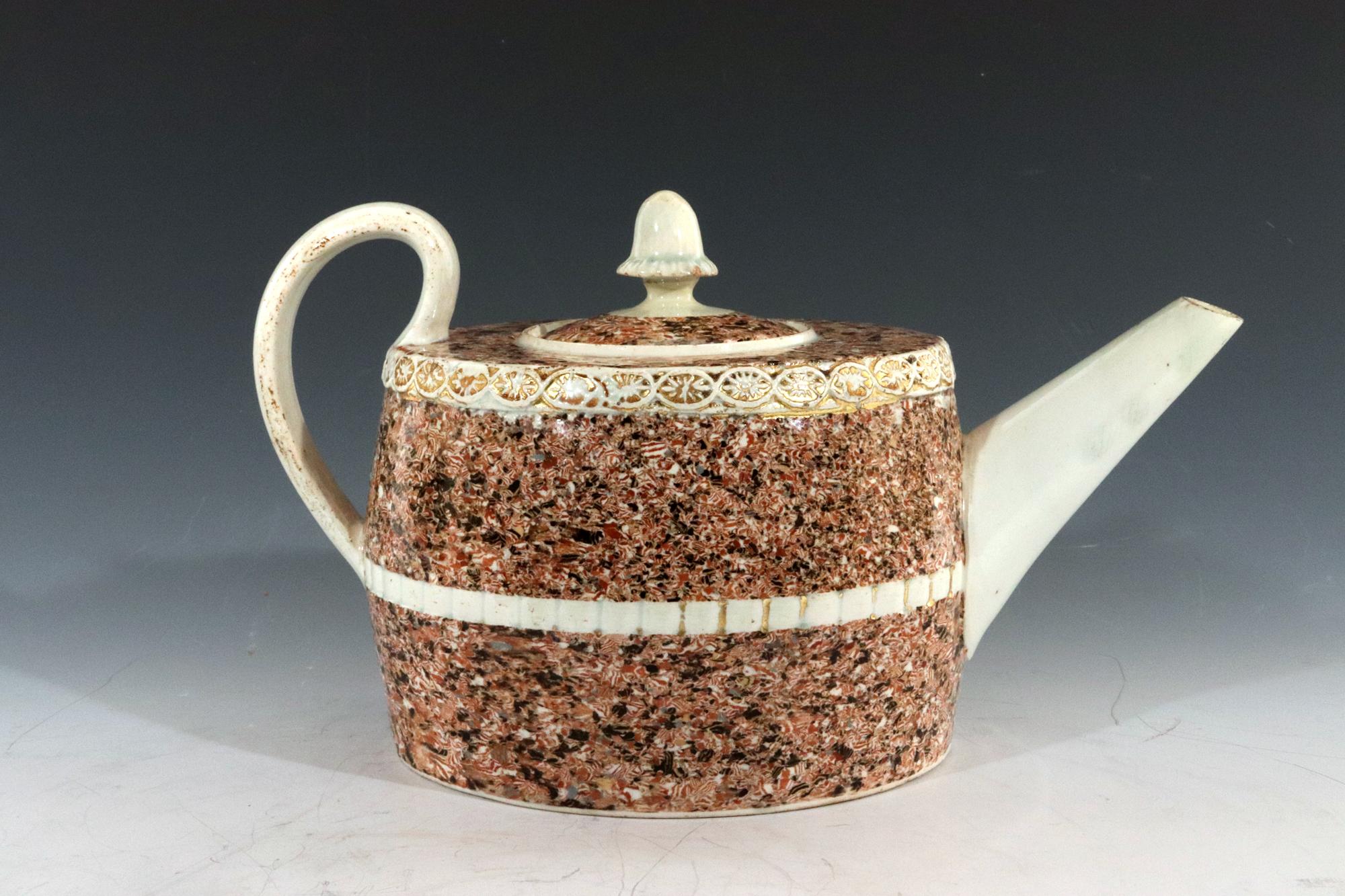 Staffordshire Pearlware Teapot and Cover with Inlaid Agate Surface and Acorn Finial, 
Attributed to the Ralph Wedgwood, 
circa 1795.

The squat oval pearlware pottery teapot has an acorn as the finial with the cover and body overlaid with