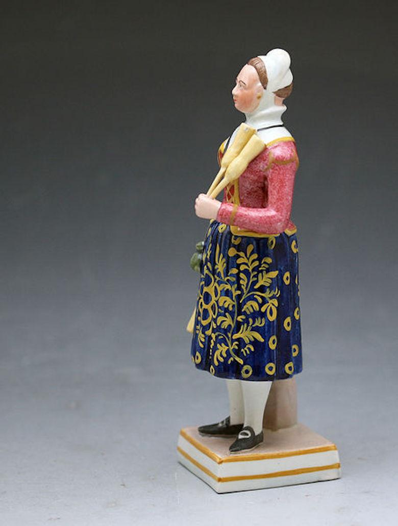 A quality pottery pearlware glaze figure of Madam Vestry in the role of the broom lady. She is modeled standing on a square base and dressed in traditional Bavarian costume, Dated circa 1825 Staffordshire, England.

Lucia Elizabeth Vestris adopted