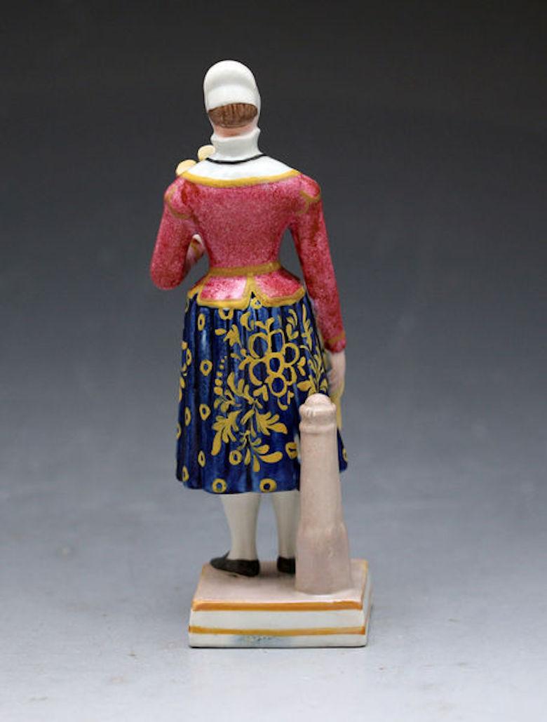 English Staffordshire Pearlware Pottery Figure of the Broom Lady, Early 19th Century