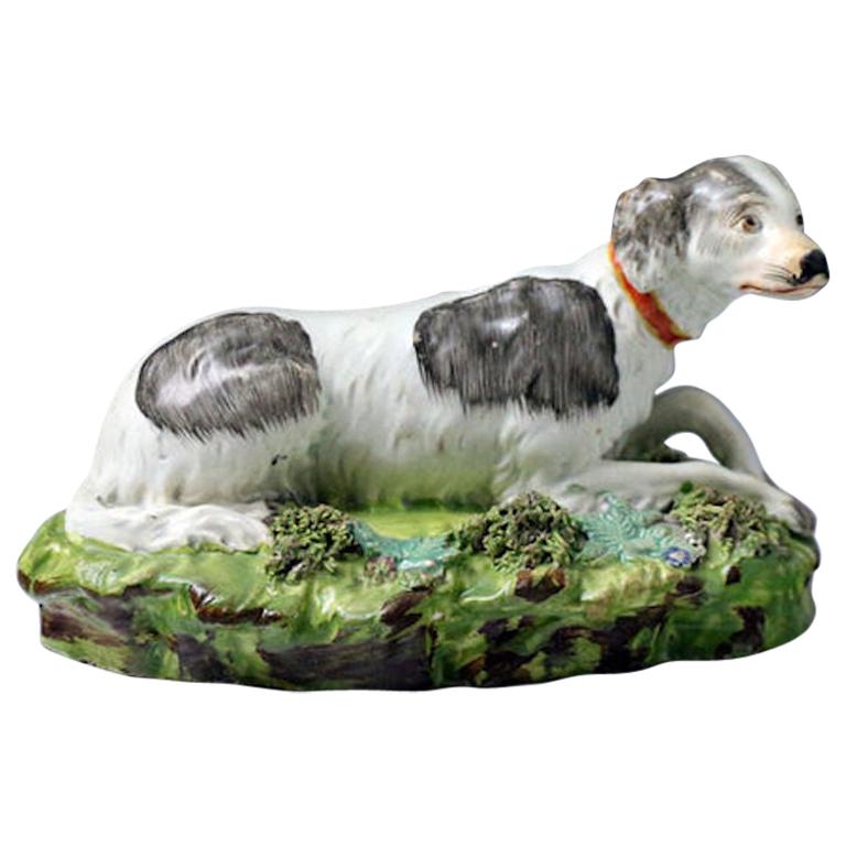 Staffordshire Pearlware Pottery Setter Dog on Green Rocky Base, circa 1820