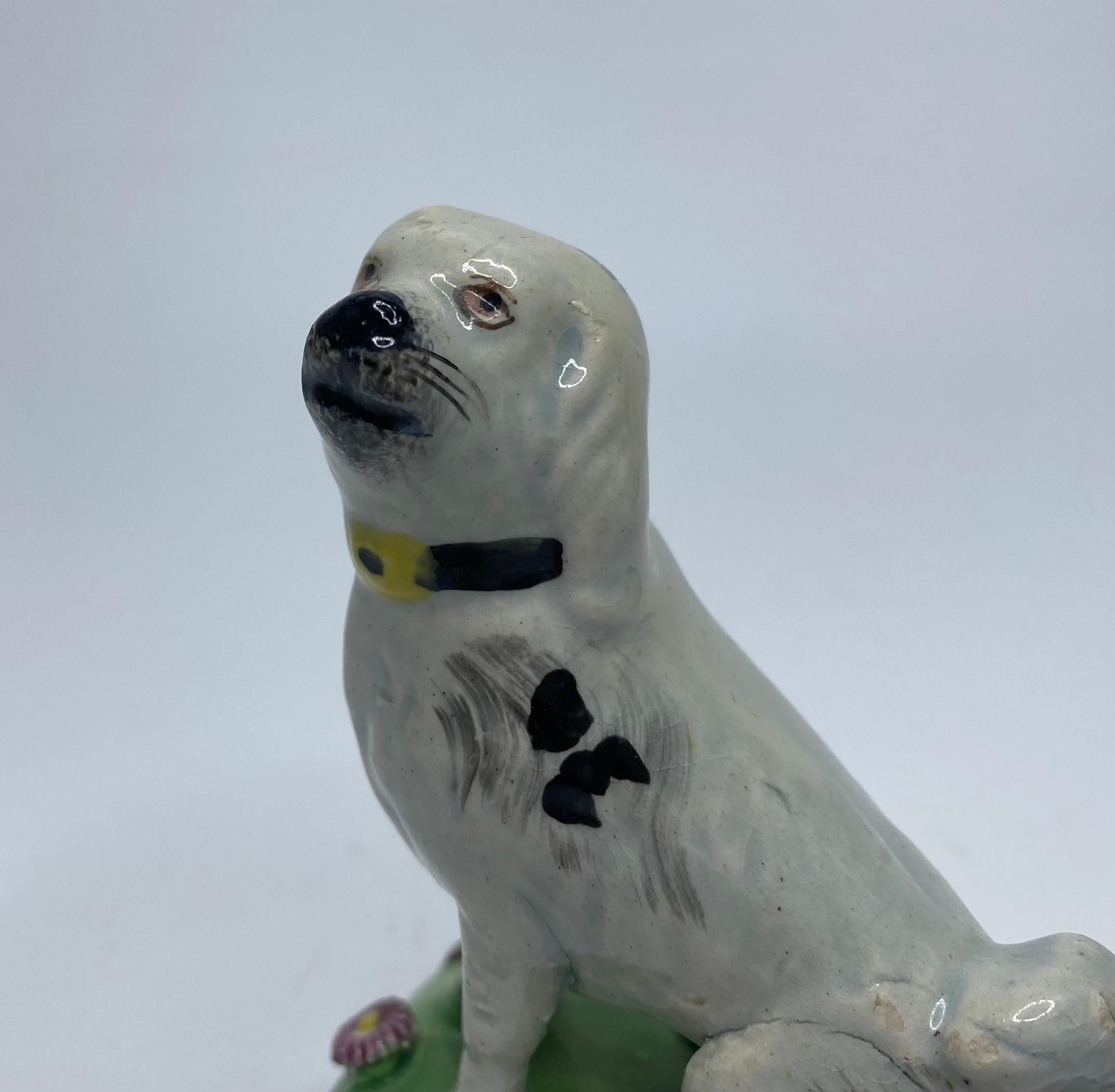 English Staffordshire pearlware seated dog, c. 1830. For Sale