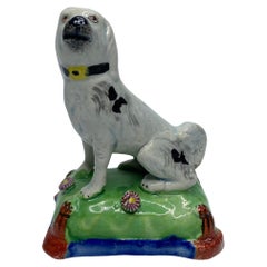 Staffordshire pearlware seated dog, c. 1830.