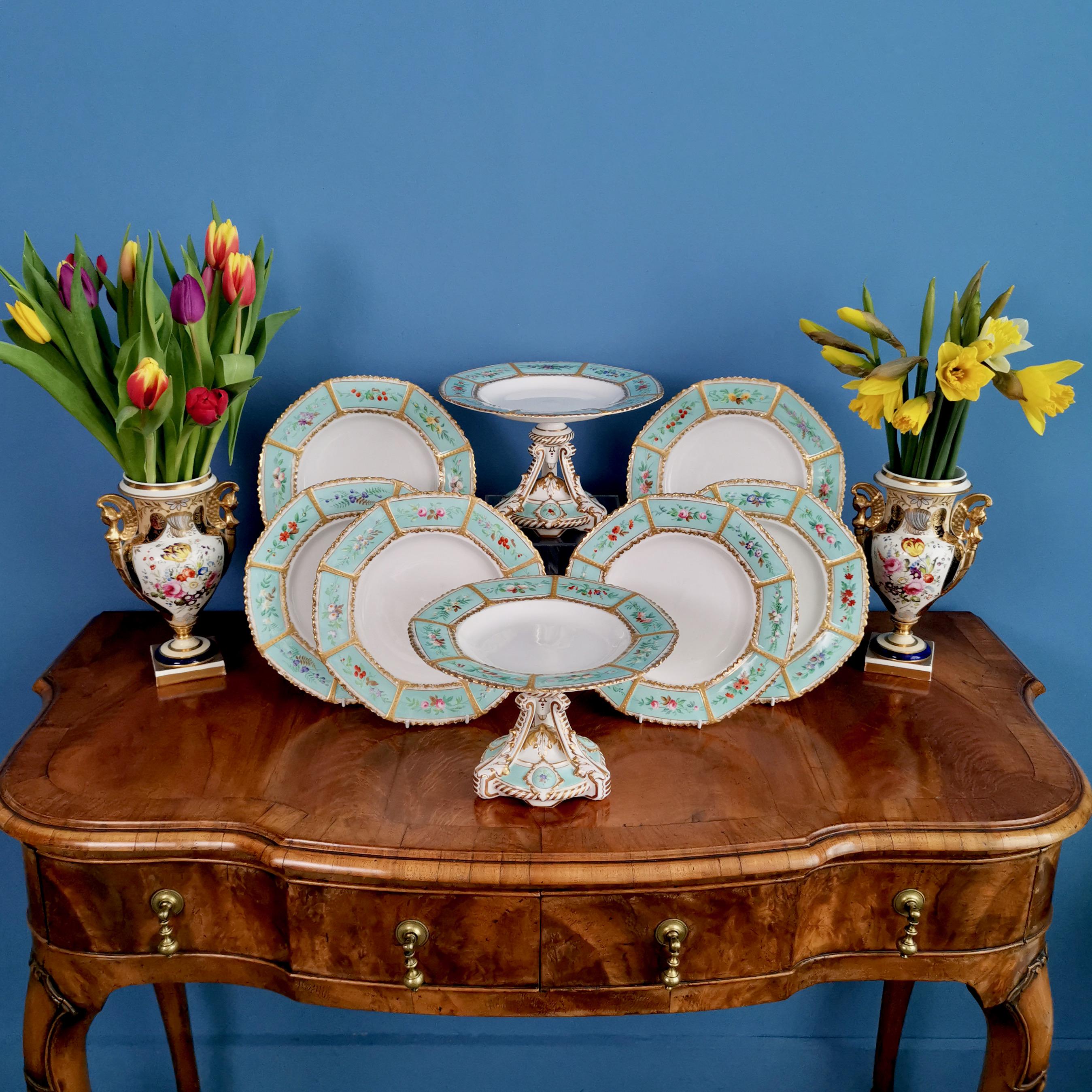 On offer is a beautiful dessert service made by a Staffordshire factory in about 1860. The items have a fresh duck egg blue ground with little printed flowers in the reserves and rich gilding. The service consists of six plates and two stunning high
