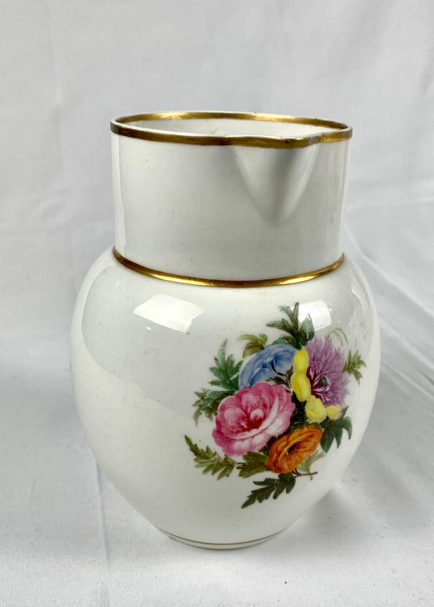 This simple, charming Staffordshire porcelain pitcher is perfect for flowers.
Made in England circa 1830, the pitcher has a beautiful hand painted bouquet on the front.
We see colors of pink, light blue, yellow, purple, orange, and two tones of