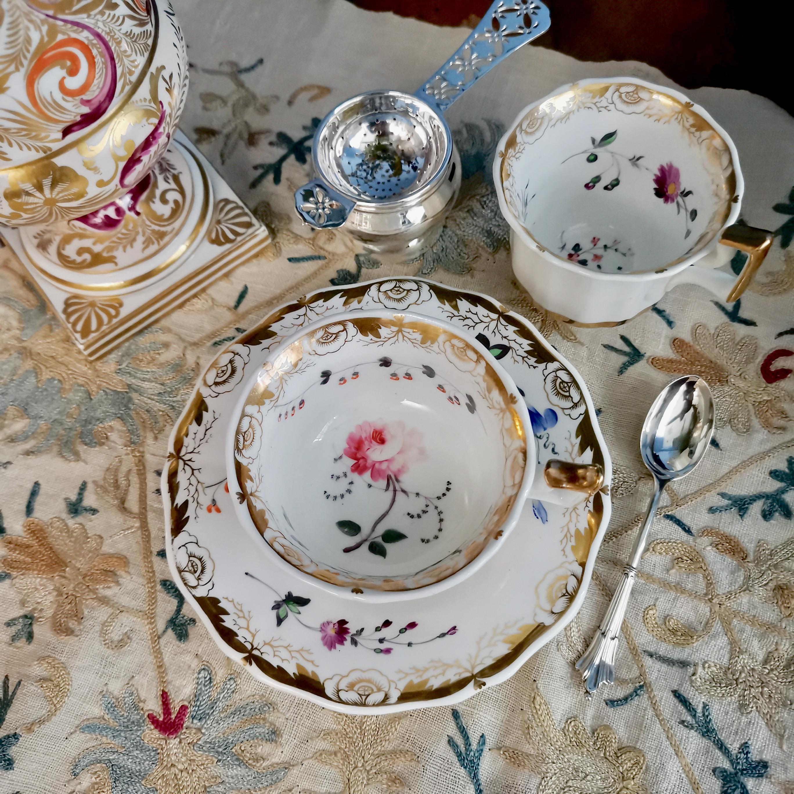 This is a beautiful trio consisting of a teacup, a coffee cup and a saucer, made by a Staffordshire factory sometime between 1825 and 1830. The set could possibly have been being made by Ridgway, Davenport or Yates, but we have not been able to