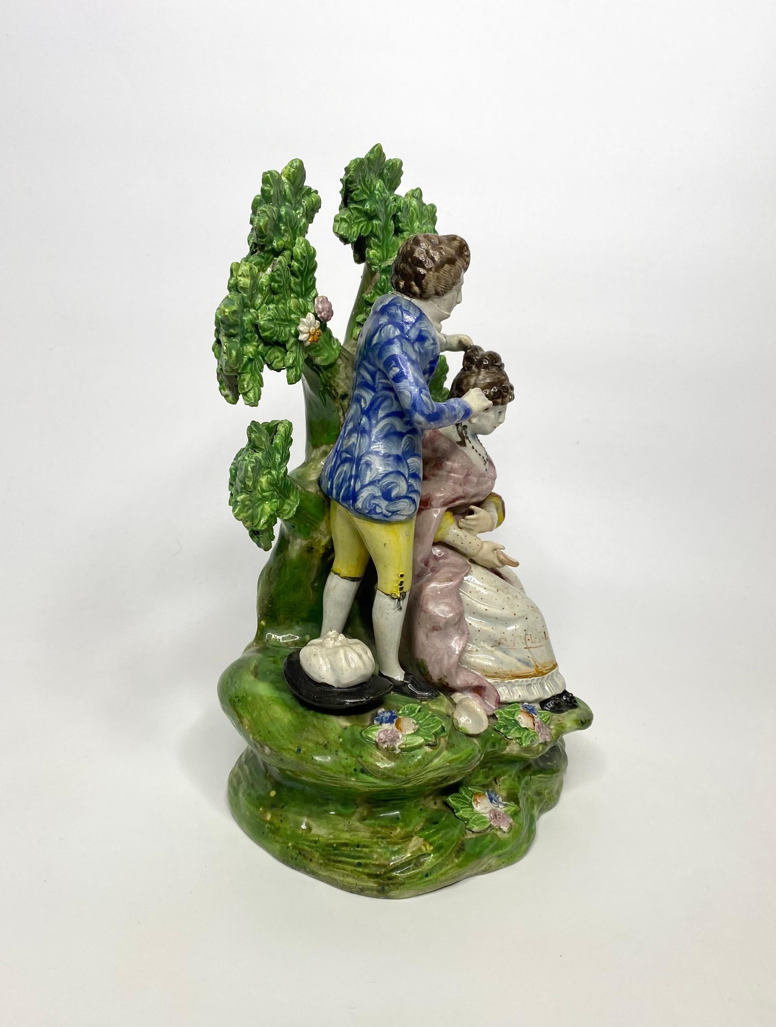 Georgian Staffordshire pottery bocage group, ‘Hairdresser’, c. 1820. For Sale