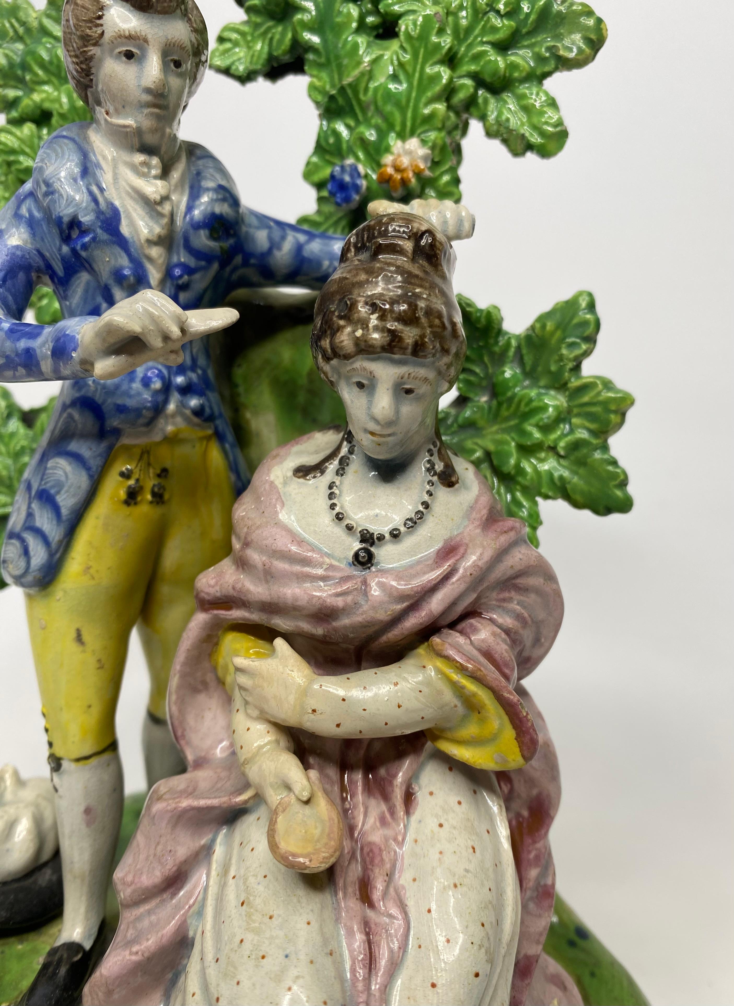 Fired Staffordshire pottery bocage group, ‘Hairdresser’, c. 1820. For Sale