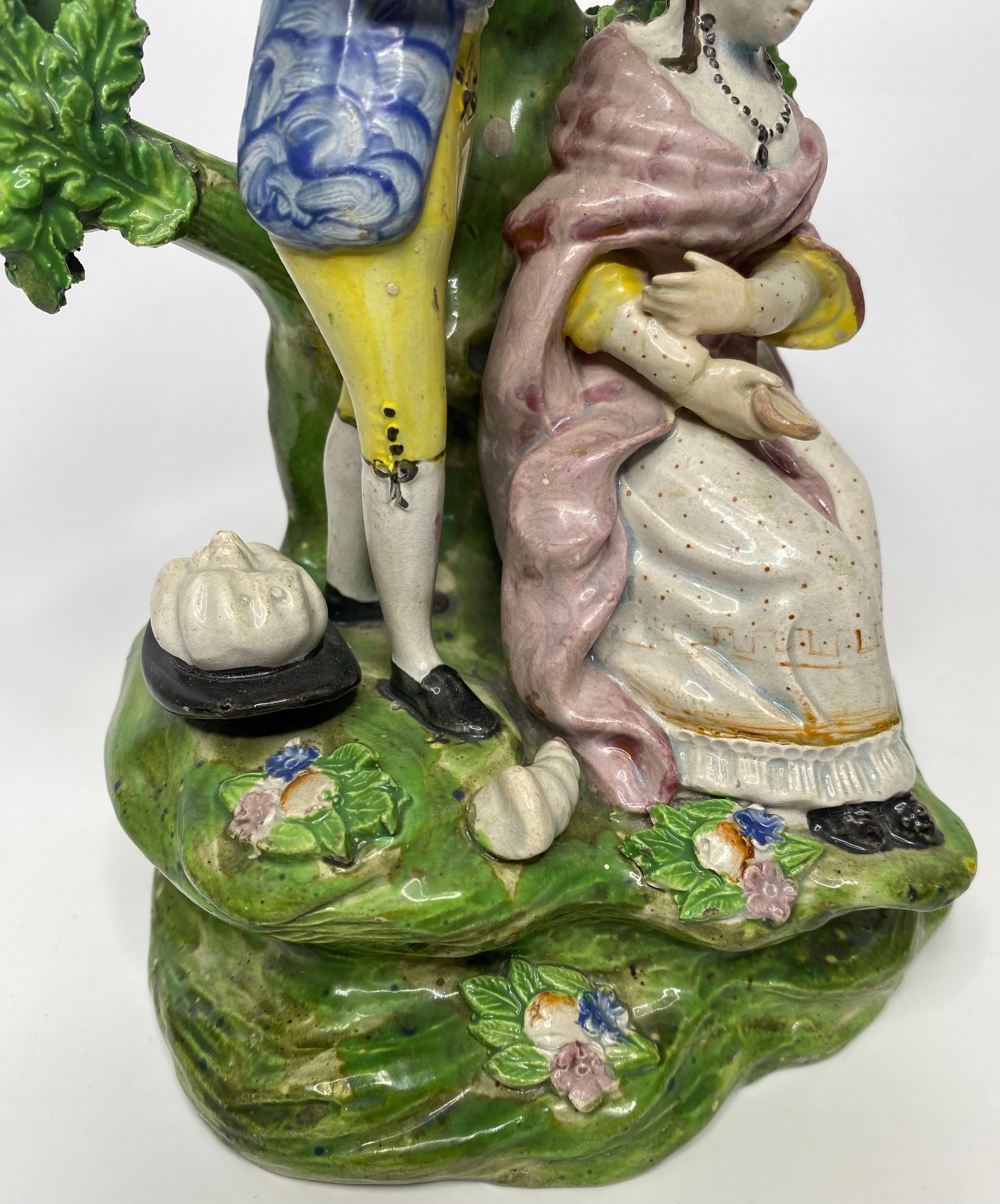 Early 19th Century Staffordshire pottery bocage group, ‘Hairdresser’, c. 1820. For Sale