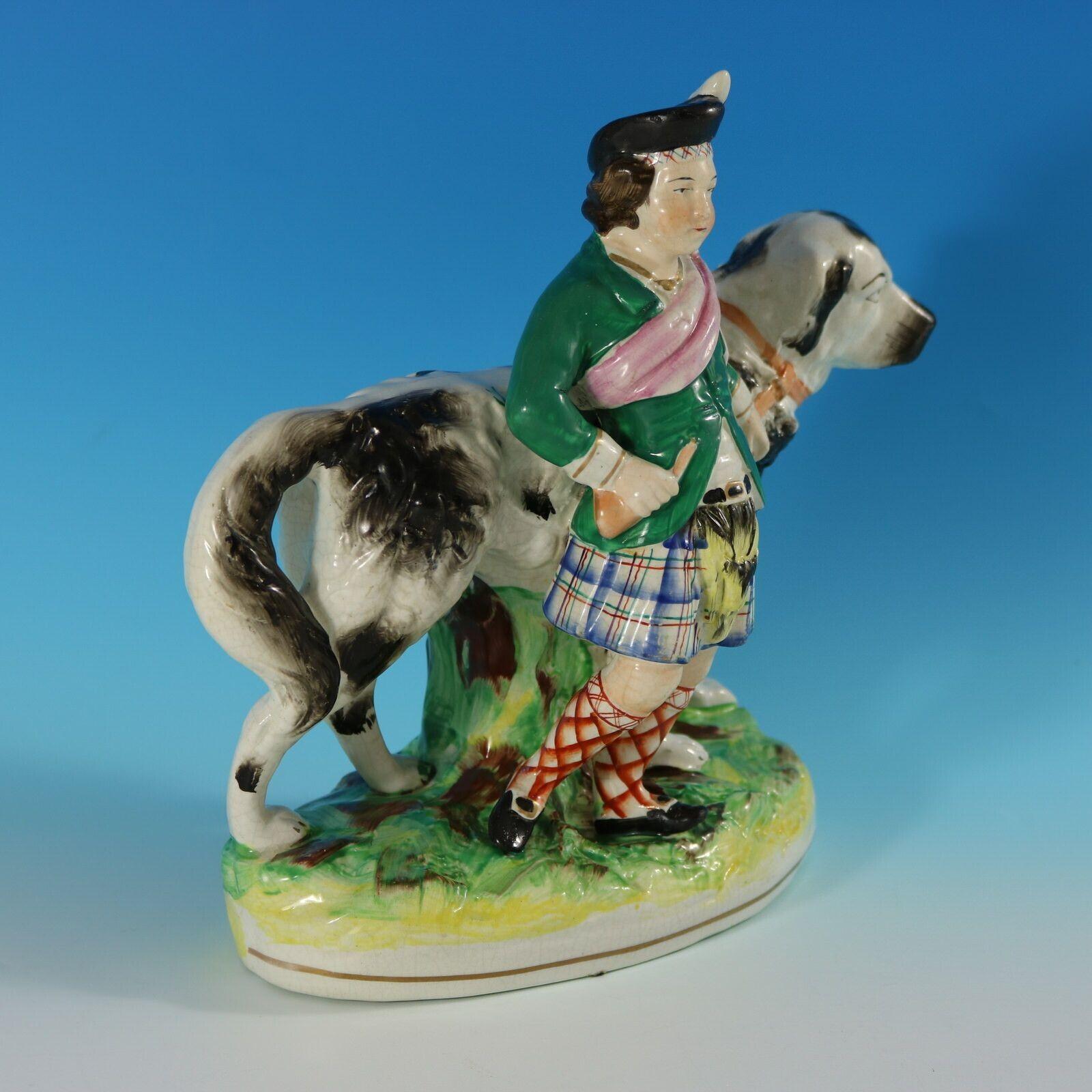 19th Century Staffordshire Pottery Boy with St. Bernard Figure For Sale