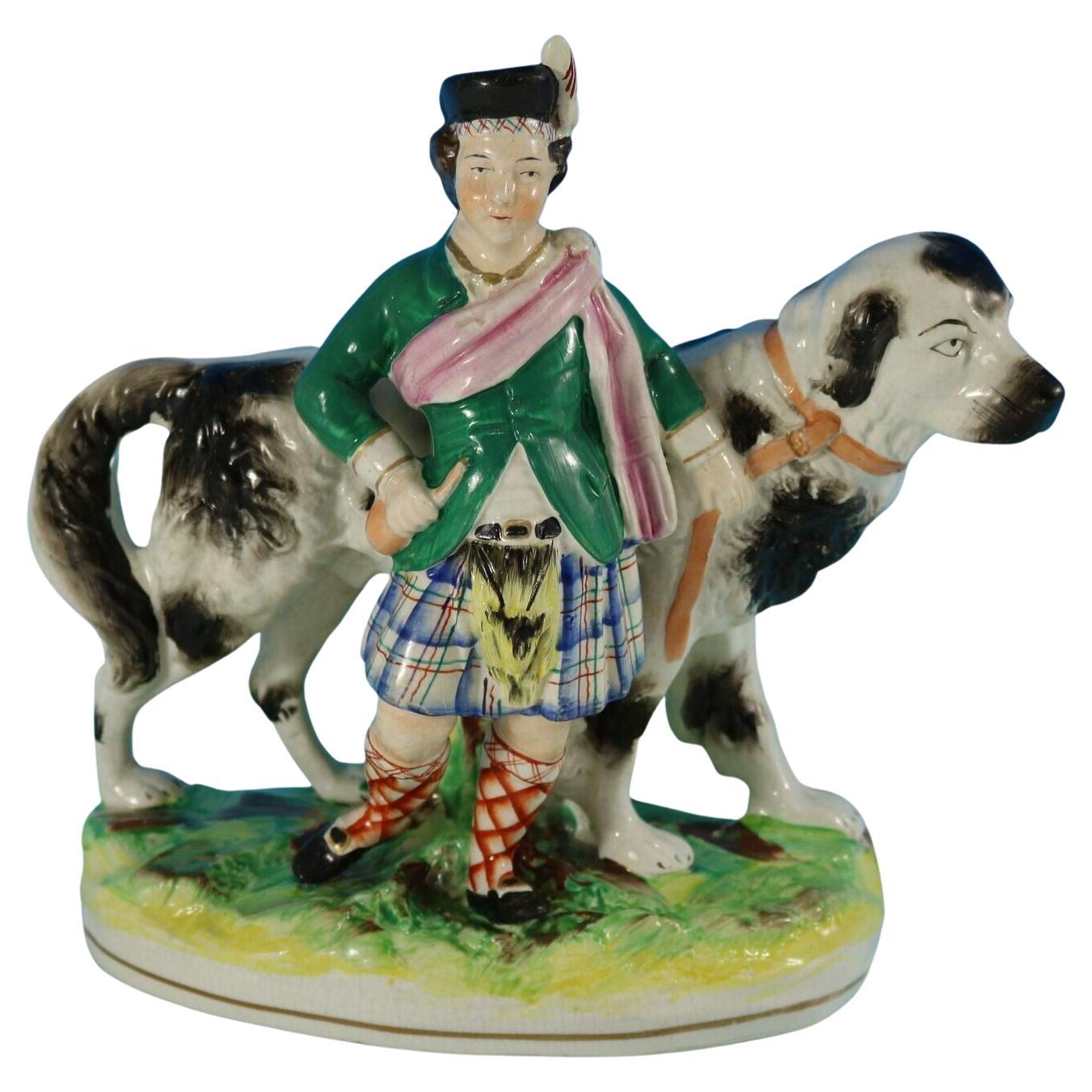 Staffordshire Pottery Boy with St. Bernard Figure For Sale