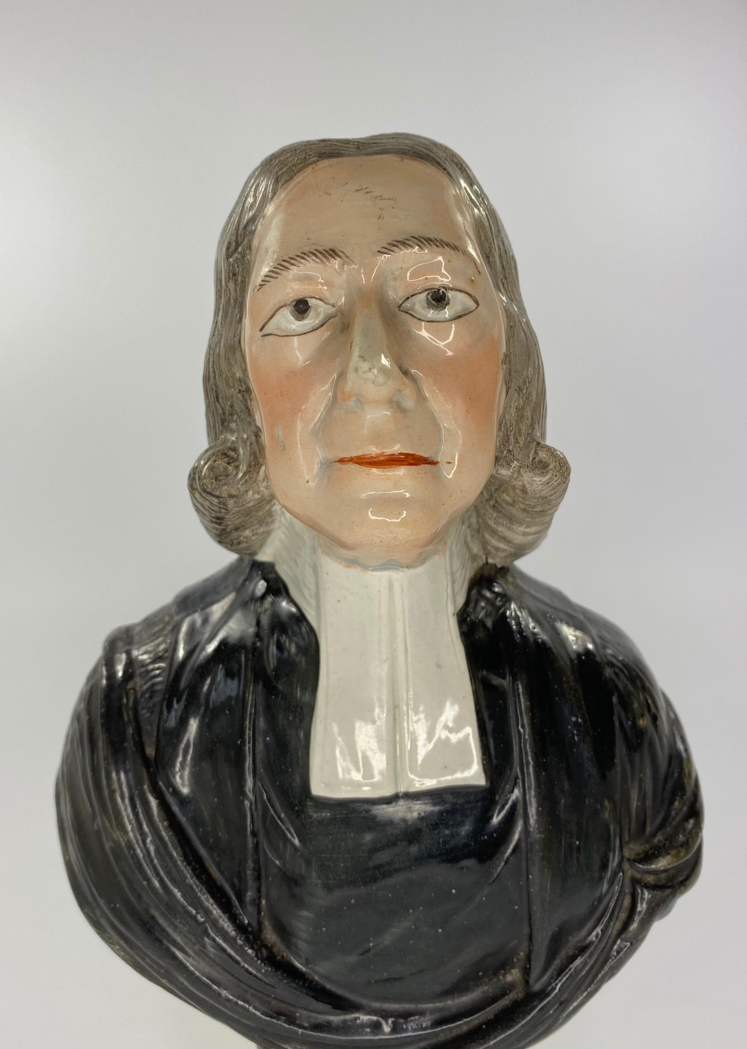 Staffordshire pottery bust, probably Enoch Wood, c. 1830. Finely modelled as John Wesley, set upon a vibrantly enamelled, socle base, beneath a pearlware glaze.
Measures: Height 28.5 cm, 11 1/4”.
Width 15.5 cm, 6 1/8”.
Depth 10.5 cm, 4