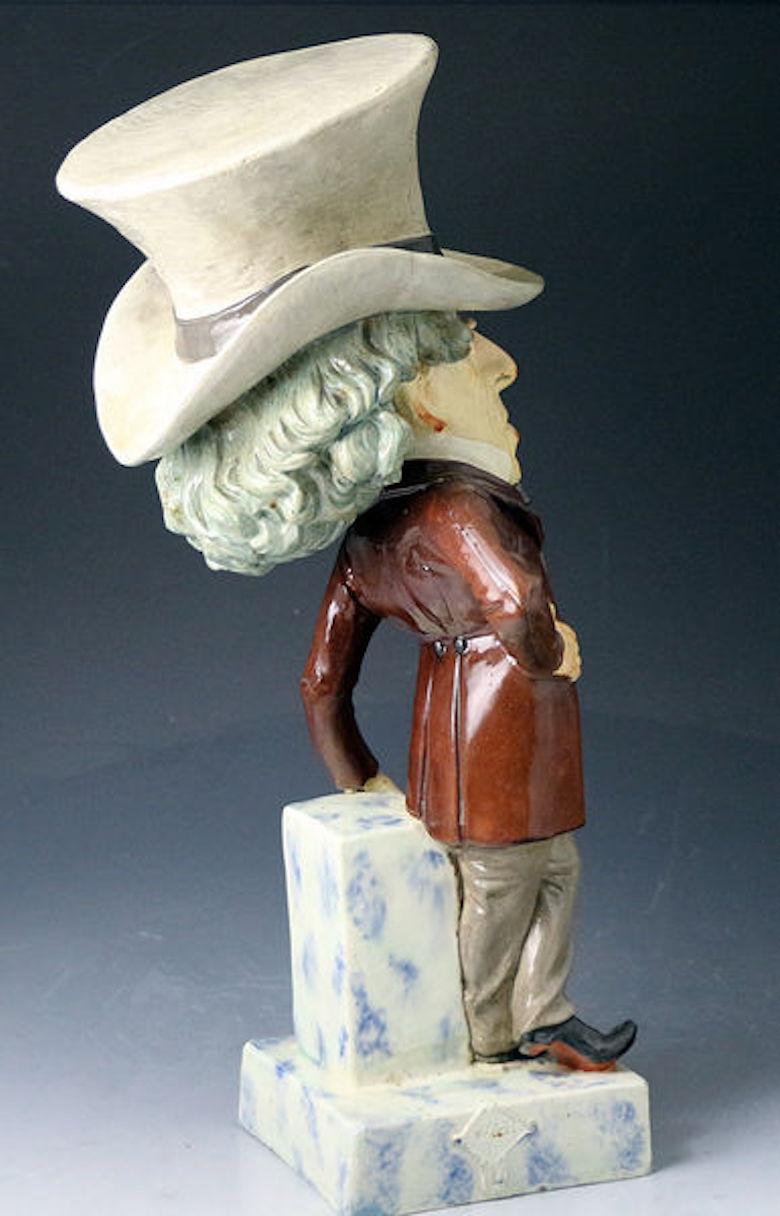 Staffordshire pottery charcture figure of Benjamin Disraeli

The pottery figure is large scale standing 17 inches tall representing an amusing caricature of Queen Victoria's favorite Prime Minister Benjamin Disraeli. This commemorative is strongly