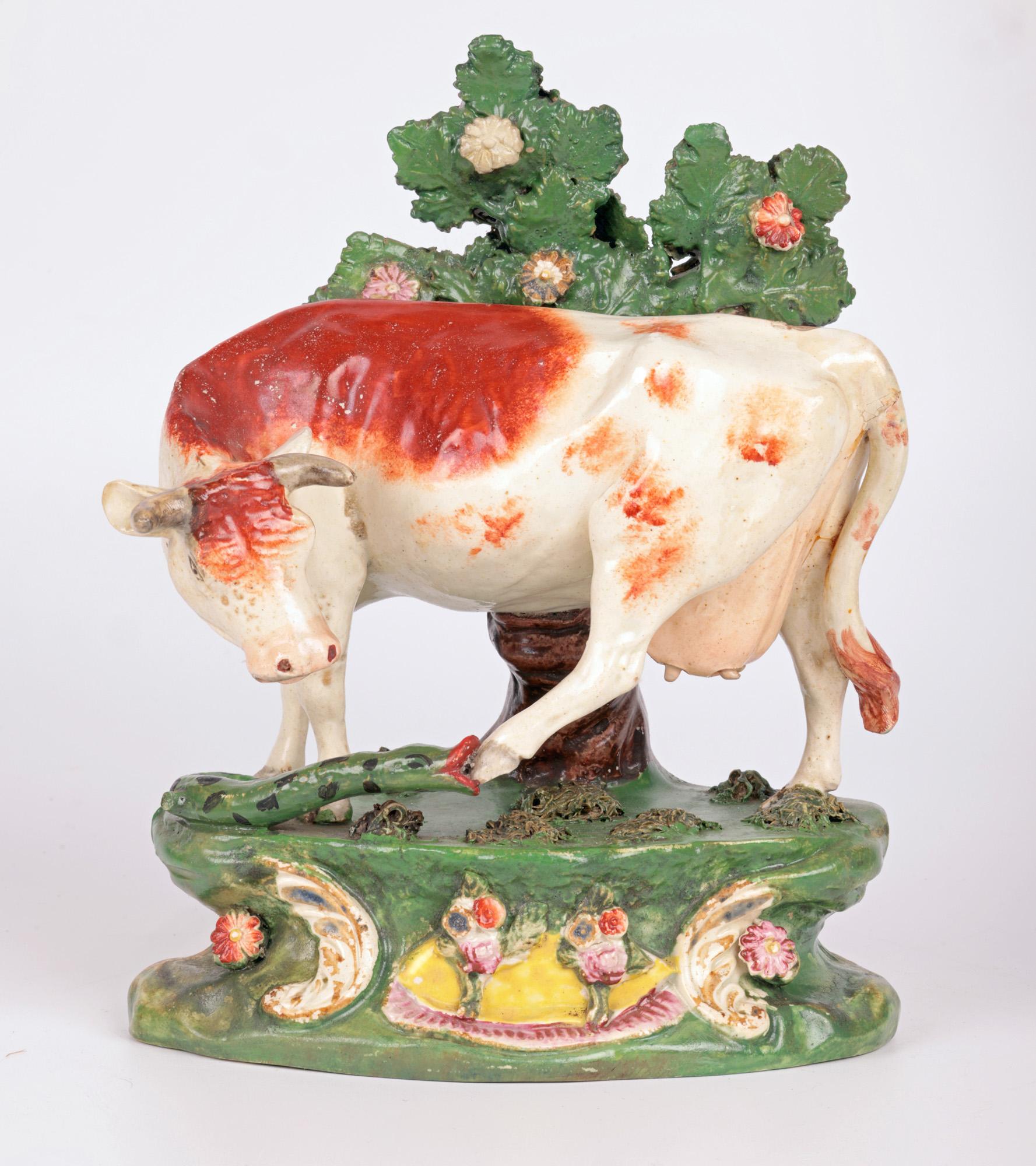 Glazed Staffordshire Pottery Cow Attacked by a Snake Pottery Figure