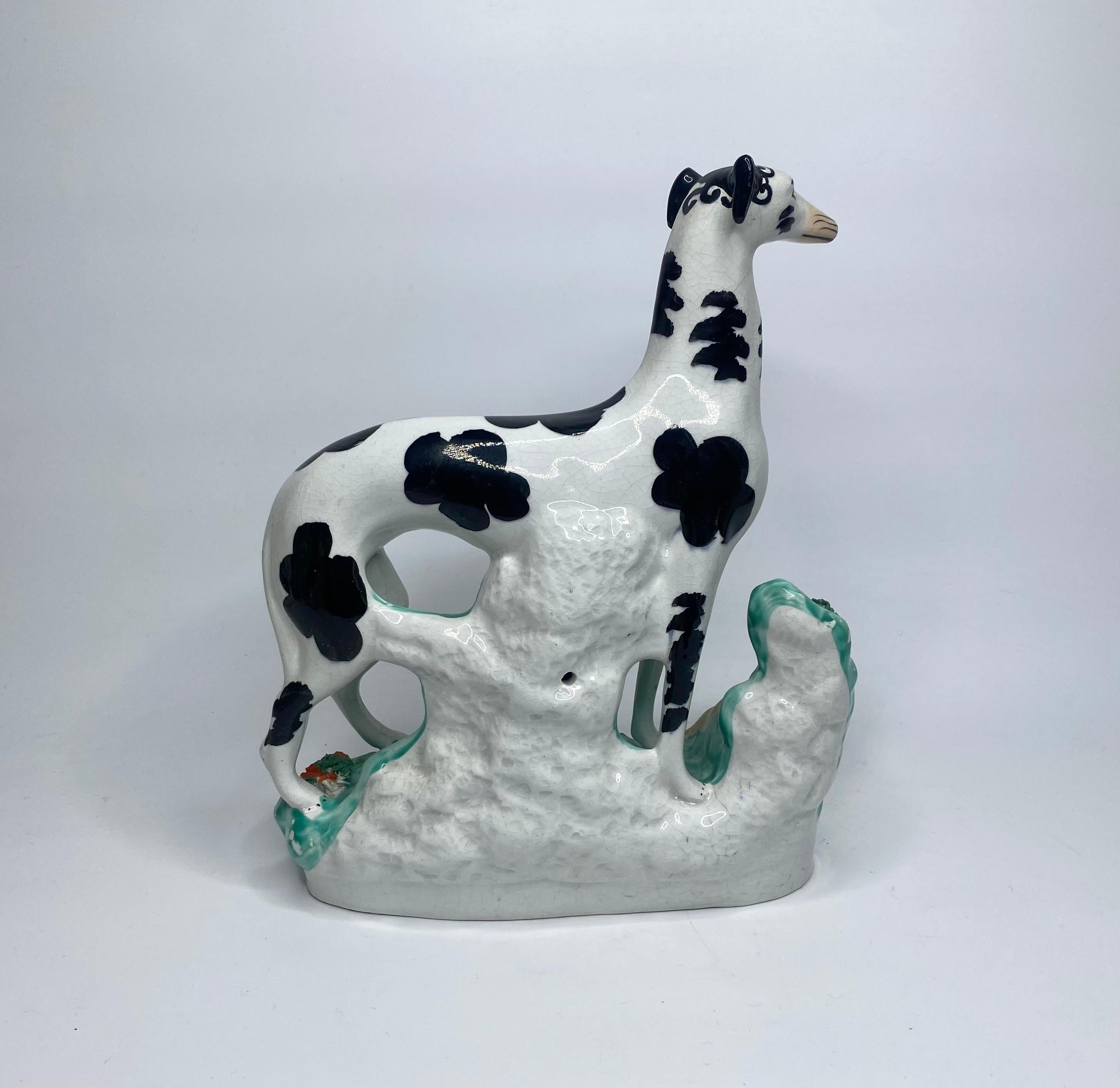 Fired Staffordshire pottery Disraeli Curl Greyhounds, c. 1850.