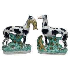Antique Staffordshire pottery Disraeli Curl Greyhounds, c. 1850.