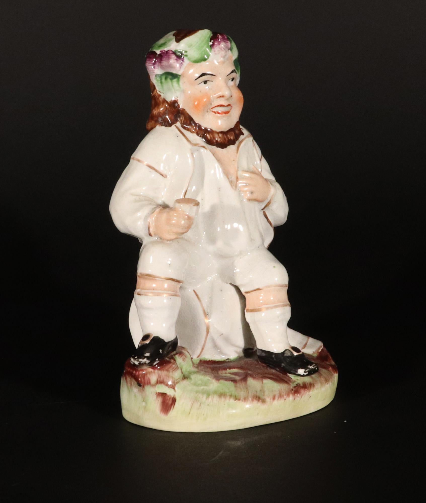 English Staffordshire Pottery Figure of Bacchus With Cup on a Wine Barrel For Sale
