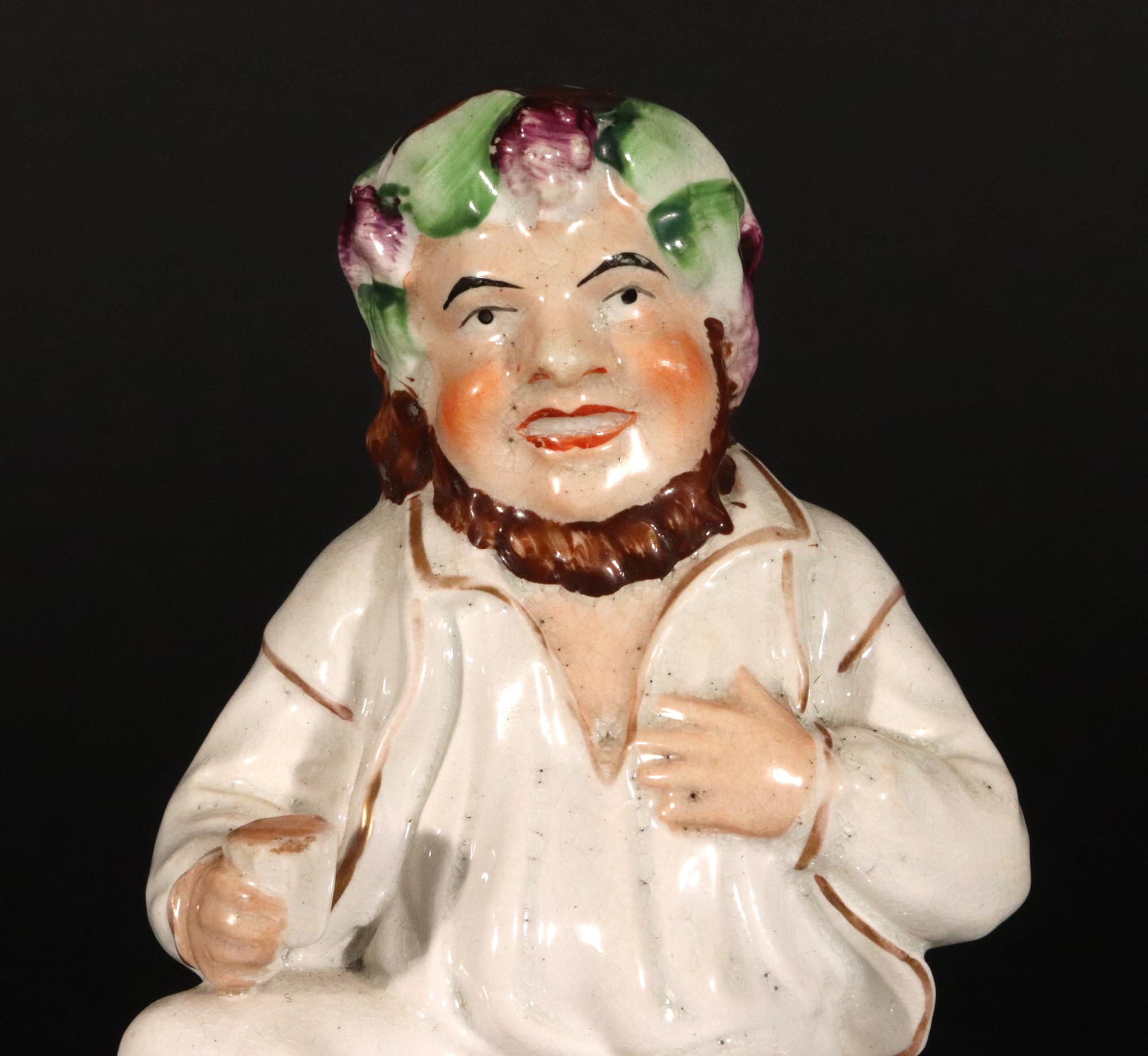 English Staffordshire Pottery Figure of Bacchus With Cup on a Wine Barrel For Sale