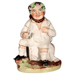 Used Staffordshire Pottery Figure of Bacchus With Cup on a Wine Barrel