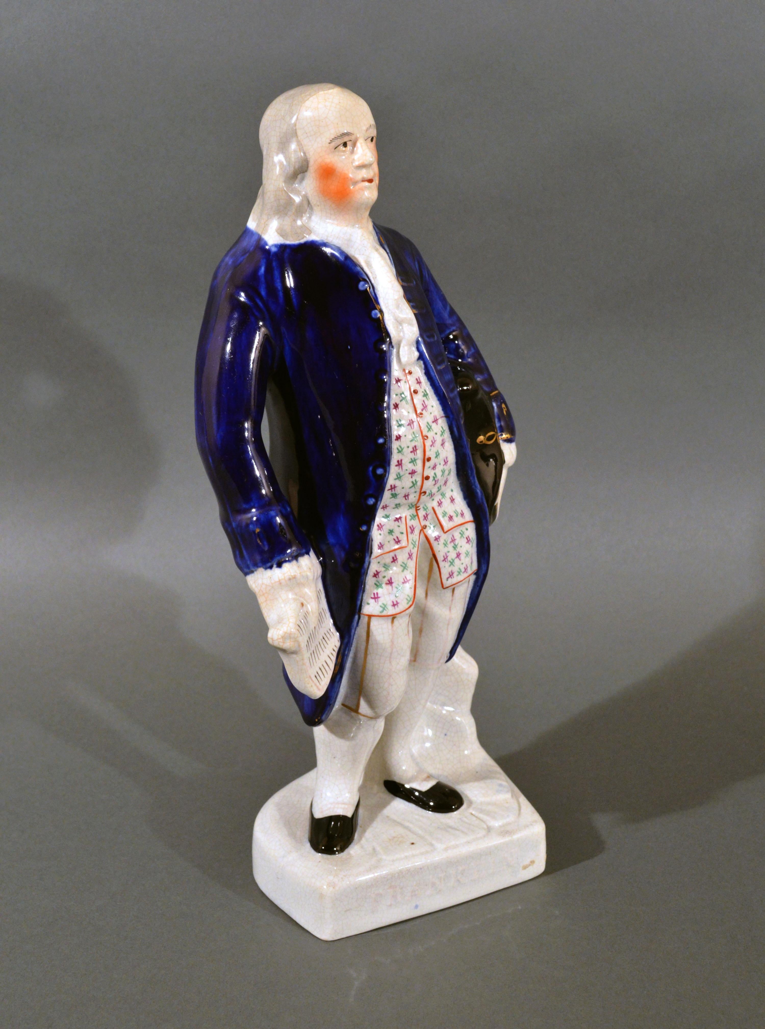 Large Staffordshire figure of Benjamin Franklin,
Named Franklin on base,
mid-19th century

This Staffordshire figure of Benjamin Franklin has a white base with the words Franklin molded in the front. Franklin stands with a Mazarin blue jacket and a