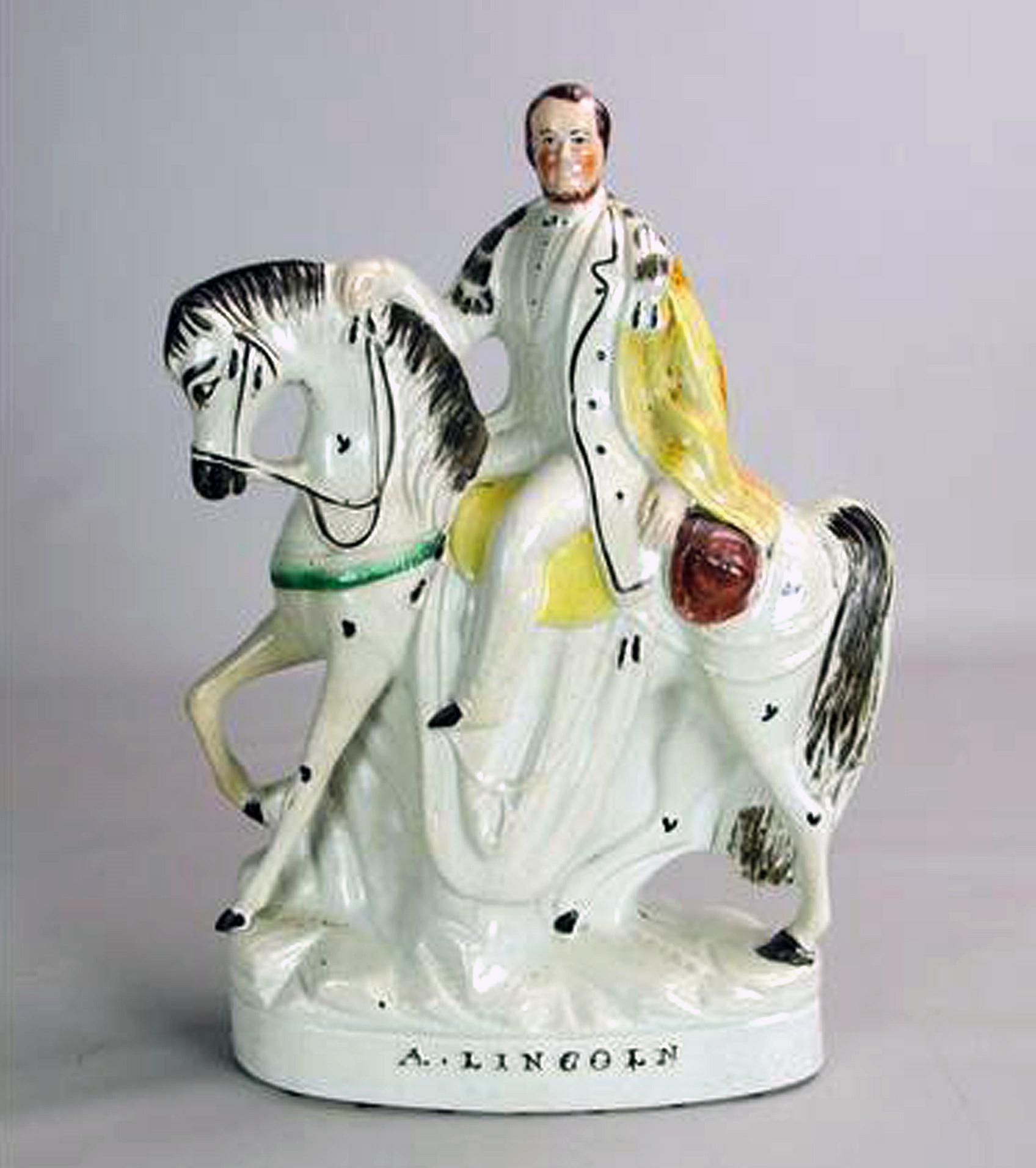 Staffordshire Pottery Figure of Lincoln on Horseback
Mid-19th Century

The figure depicts President Abraham Lincoln sitting on horseback, his head turned towards the viewer, on an oval base with the name A. LINCOLN embossed in black in the front