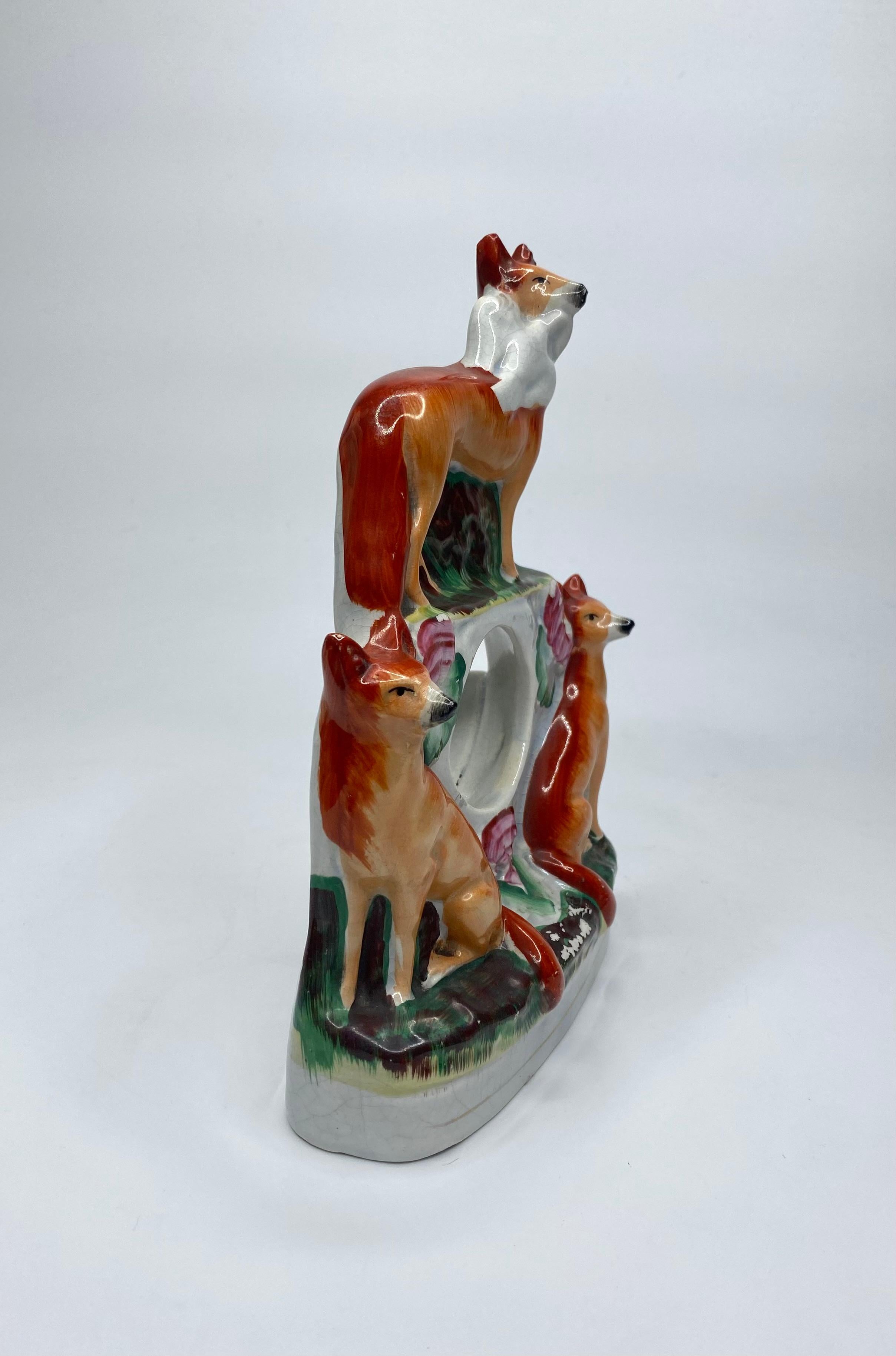 English Staffordshire pottery Foxes watch holder, c. 1860. For Sale