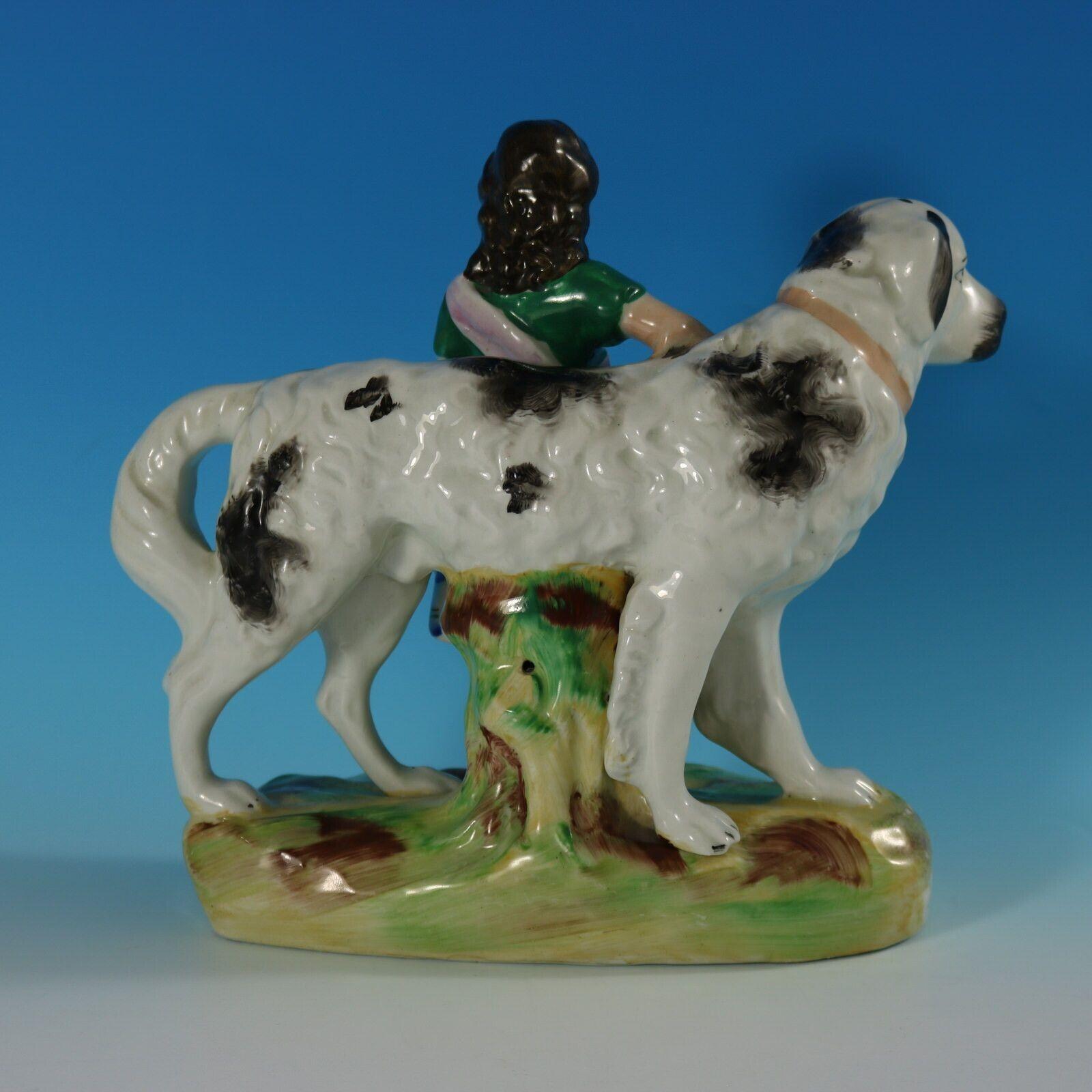 English Staffordshire Pottery Girl with St. Bernard Figure For Sale