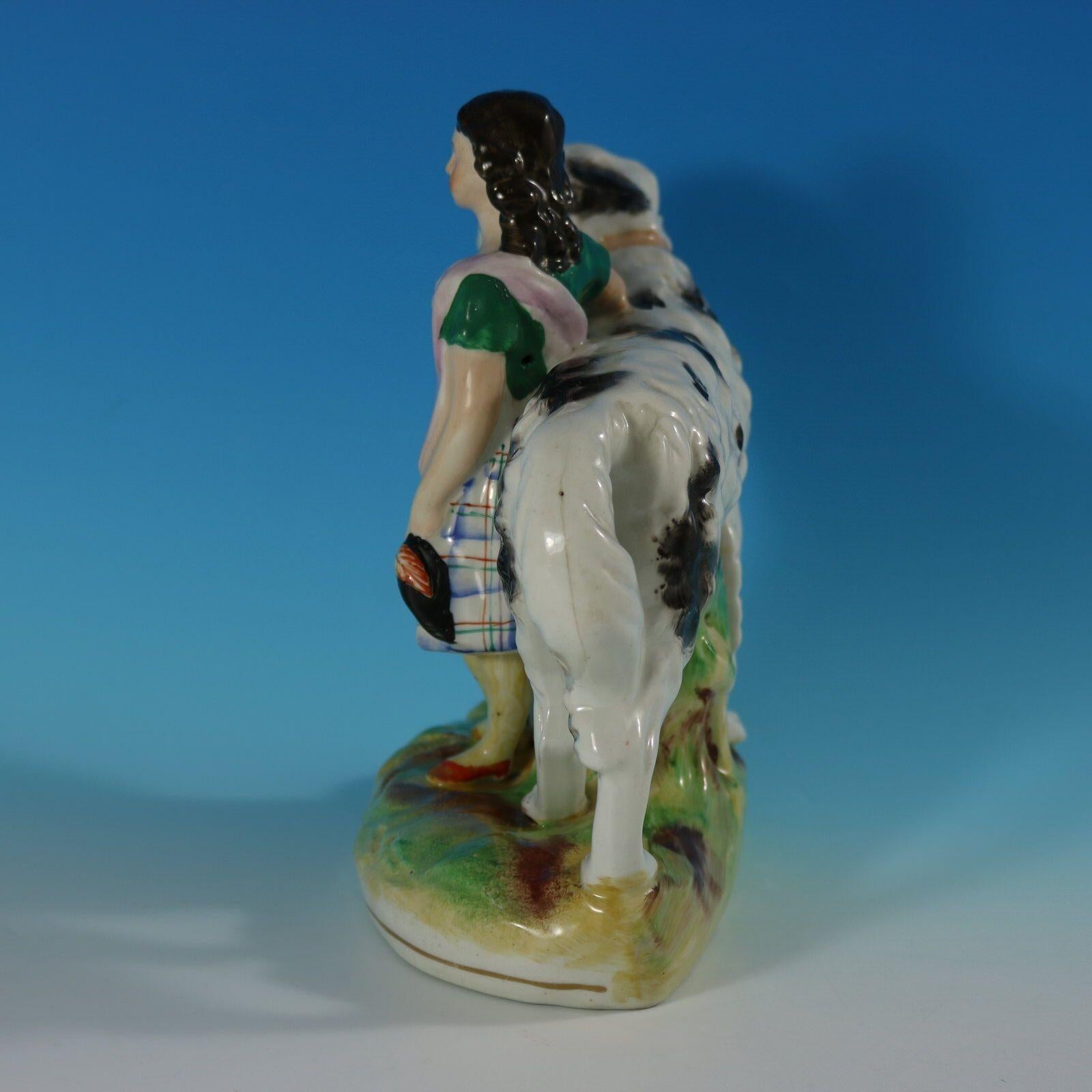 Late 19th Century Staffordshire Pottery Girl with St. Bernard Figure For Sale