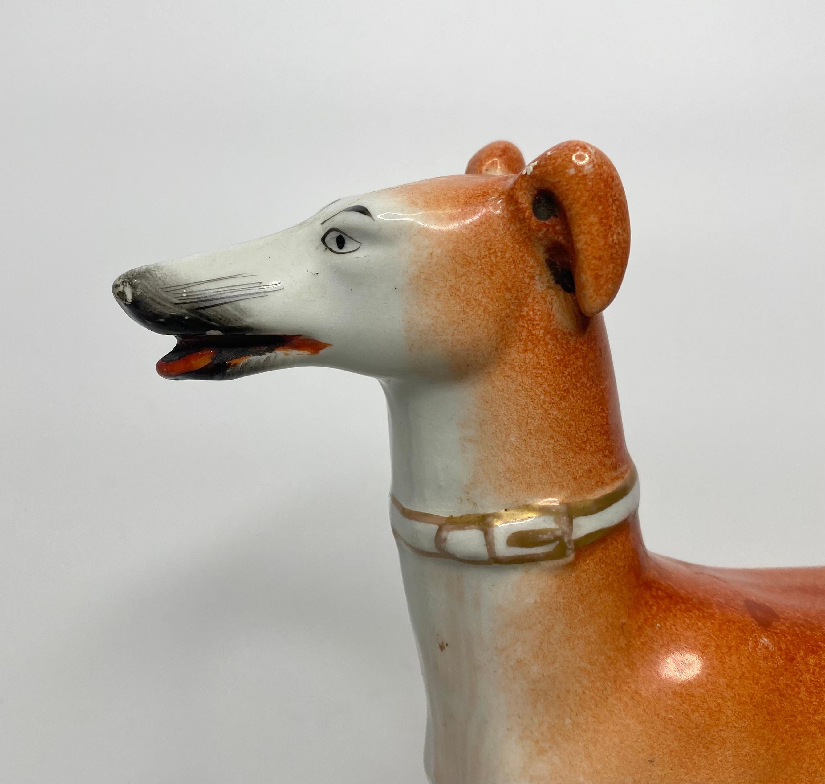 A rare Staffordshire pottery figure of a Greyhound, Thomas Parr factory, c. 1850. Whilst initially looking similar to a standard Staffordshire figure of a Greyhound, this particular example, is exceptionally well modelled, and fully decorated in the