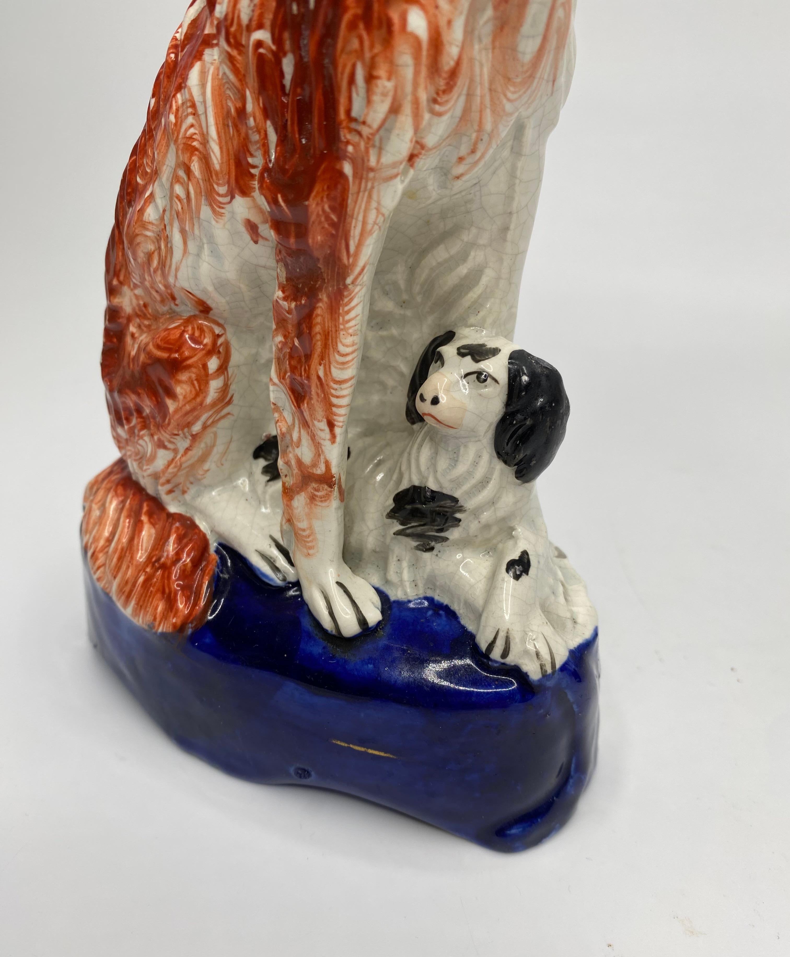 Mid-19th Century Staffordshire pottery Irish Setters, and puppies, c. 1850. For Sale