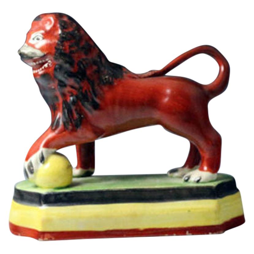 Staffordshire Pottery Pearlware Figure of a Standing Lion on Base For Sale