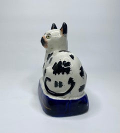 Staffordshire pottery recumbent cat, c. 1850.