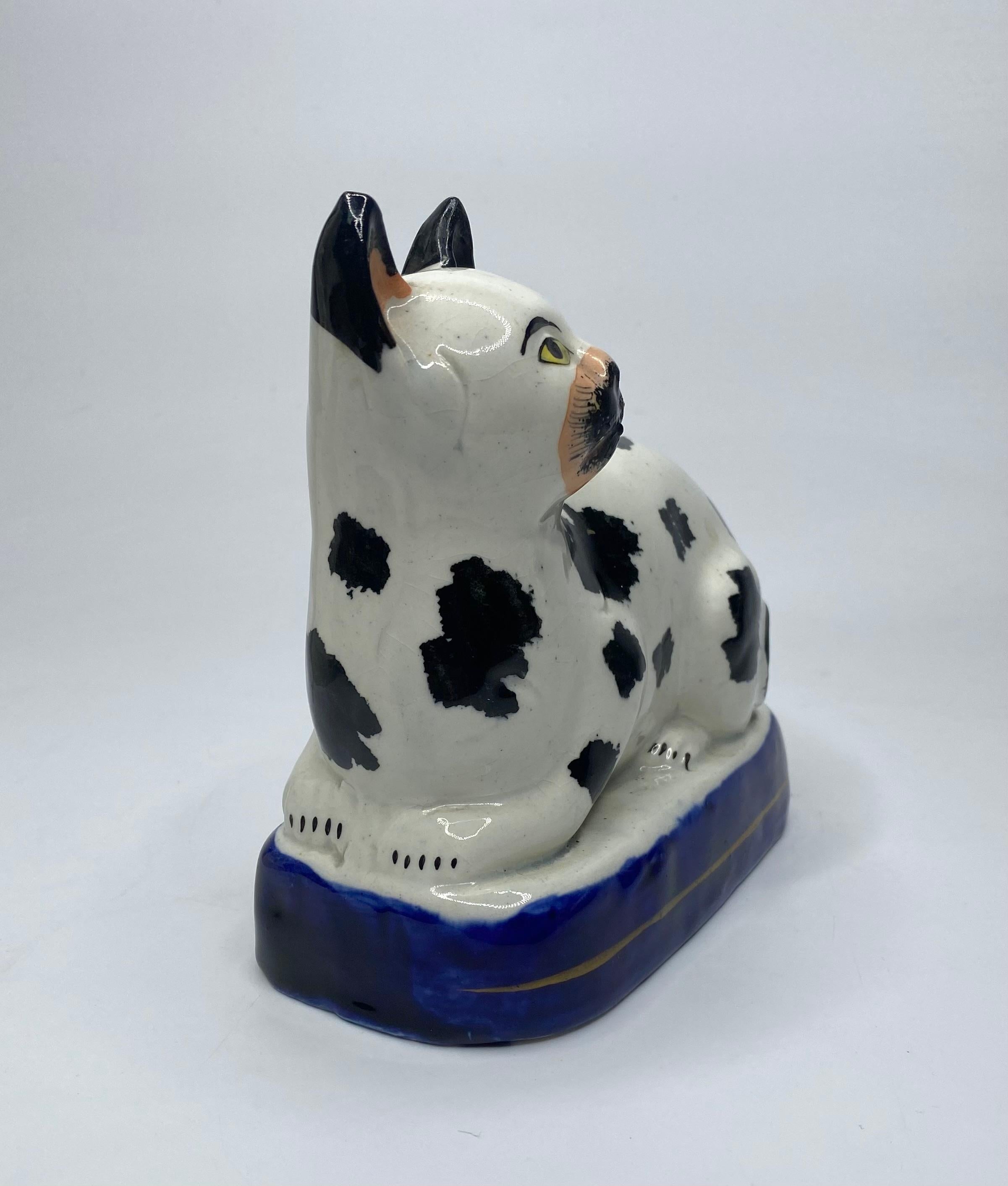 English Staffordshire pottery recumbent cat, c. 1850. For Sale