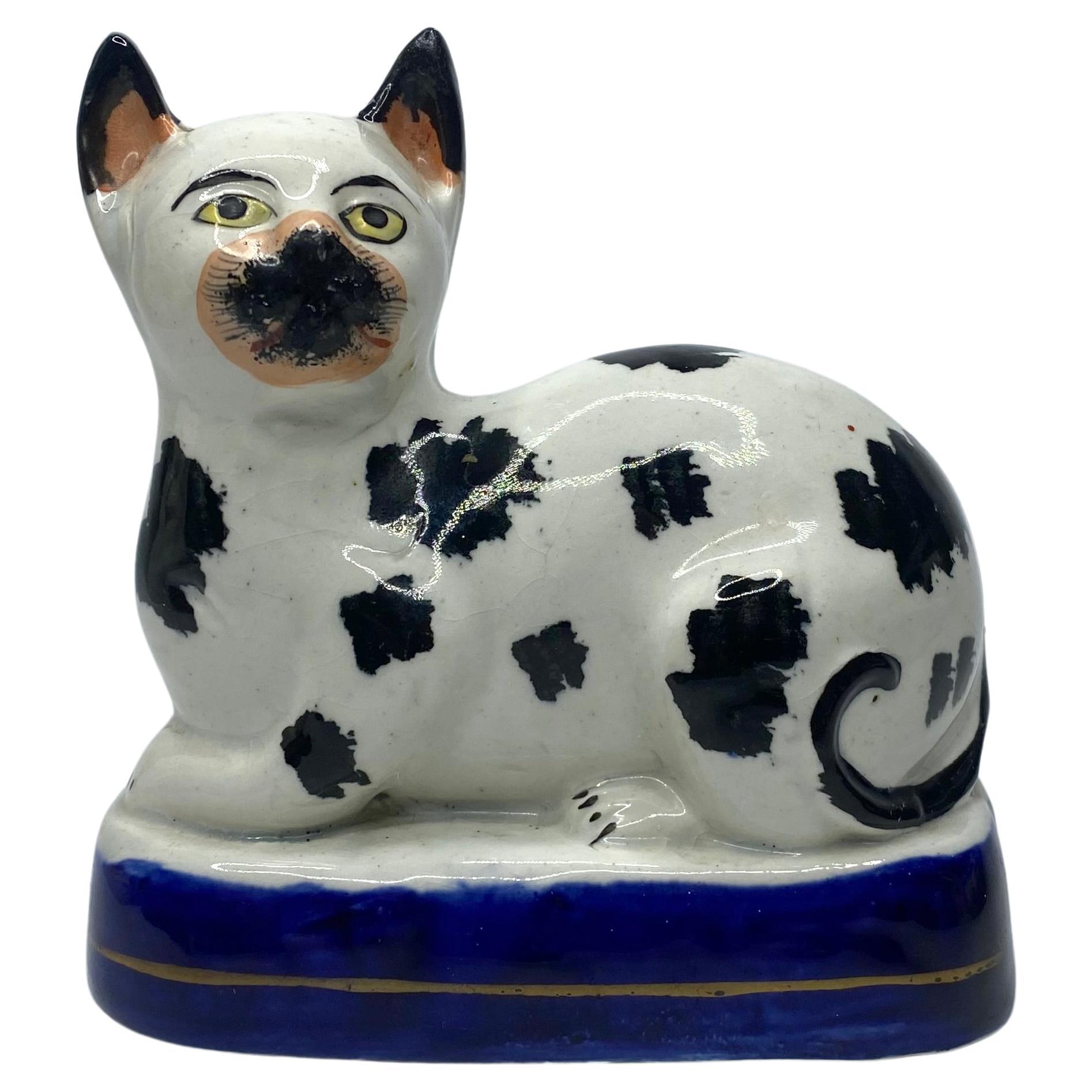 Staffordshire pottery recumbent cat, c. 1850. For Sale