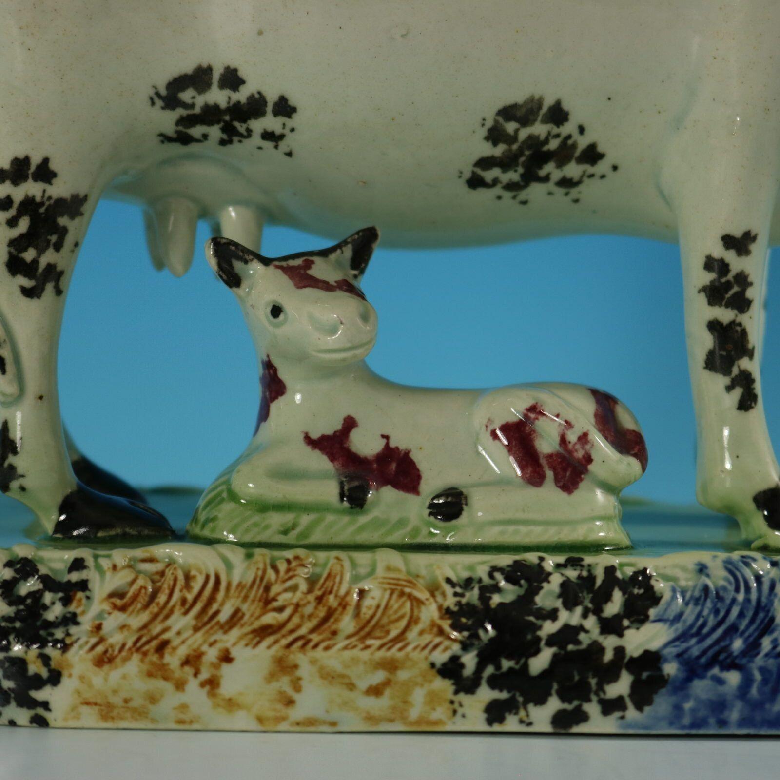 19th Century Staffordshire Yorkshire Pottery Prattware Cow & Calf Group For Sale
